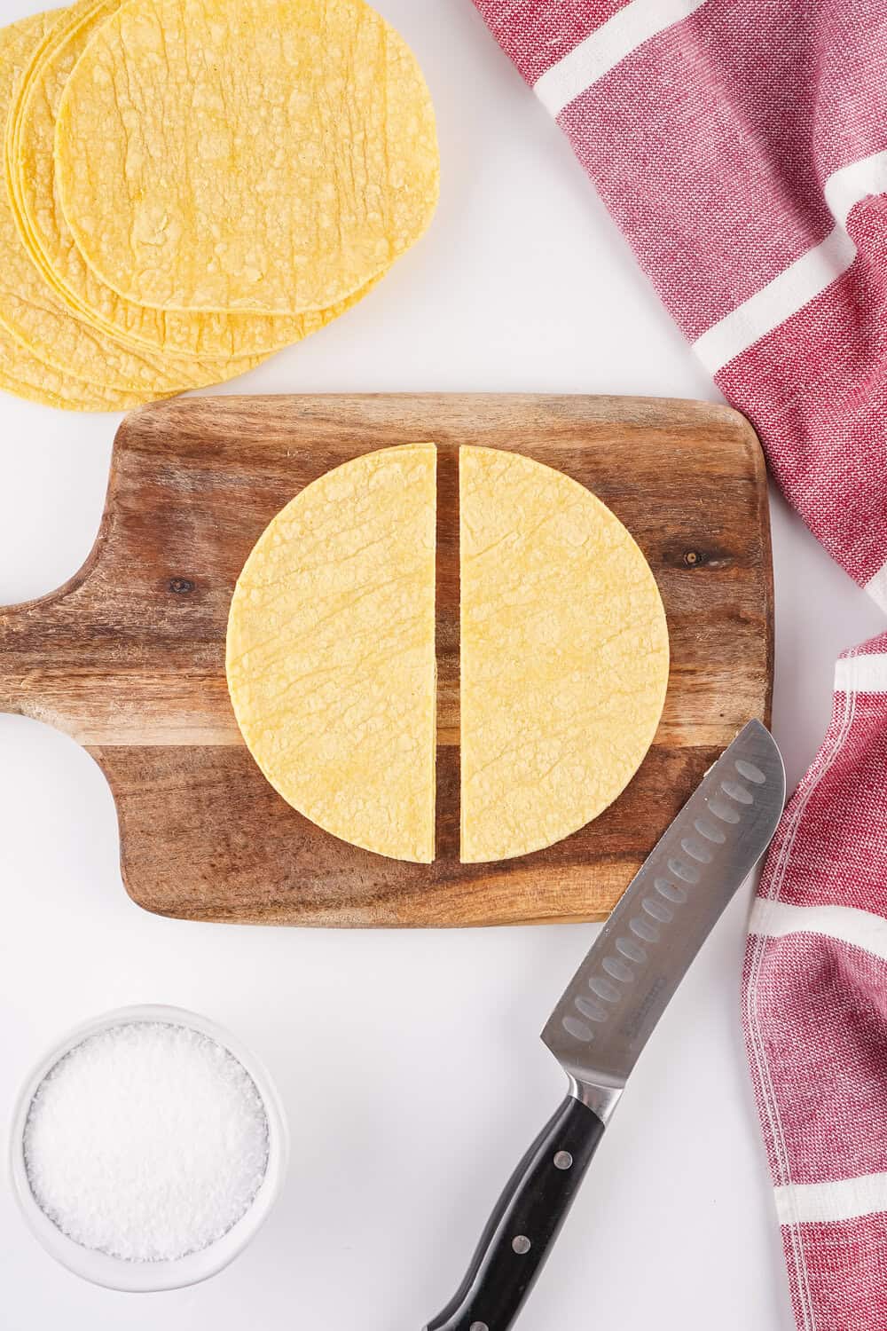 corn tortilla on cutting board cut in half