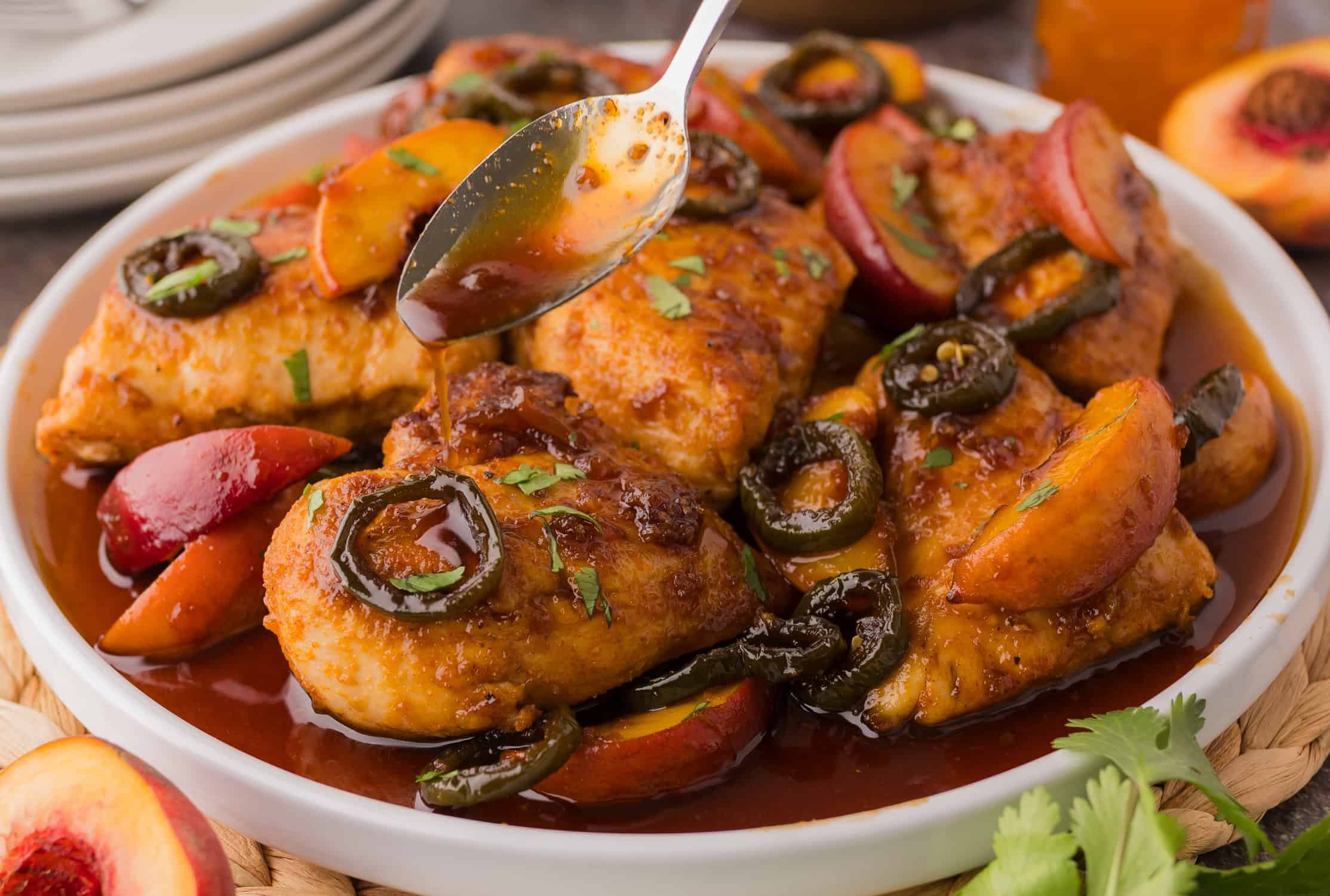 Jalapeno Chicken with Peaches in a white bowl
