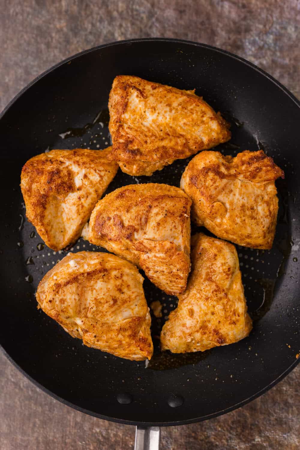 cooking chicken in a skillet