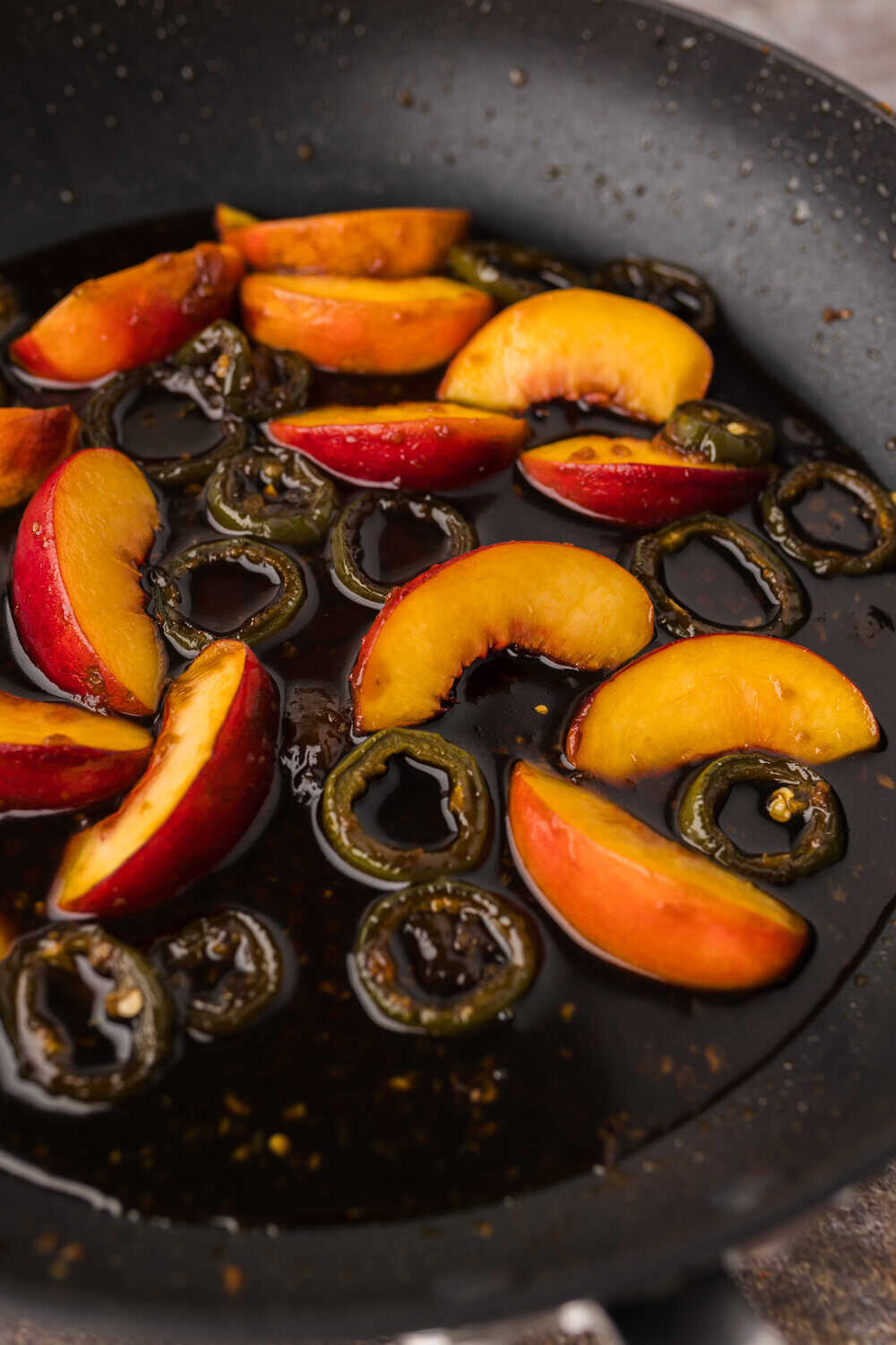 thickened peach jalapeno glaze in a skillet