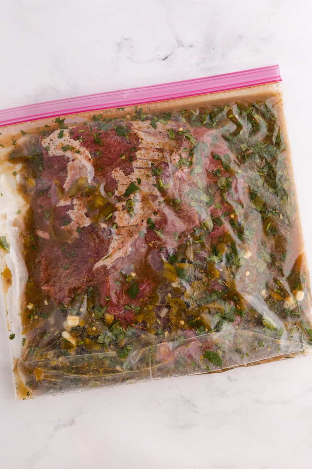 carne asada steak in bag of marinade