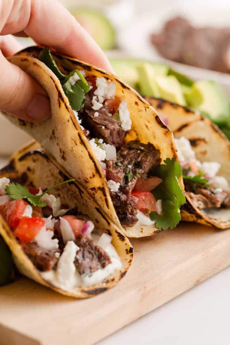 hand holding a carne asada taco