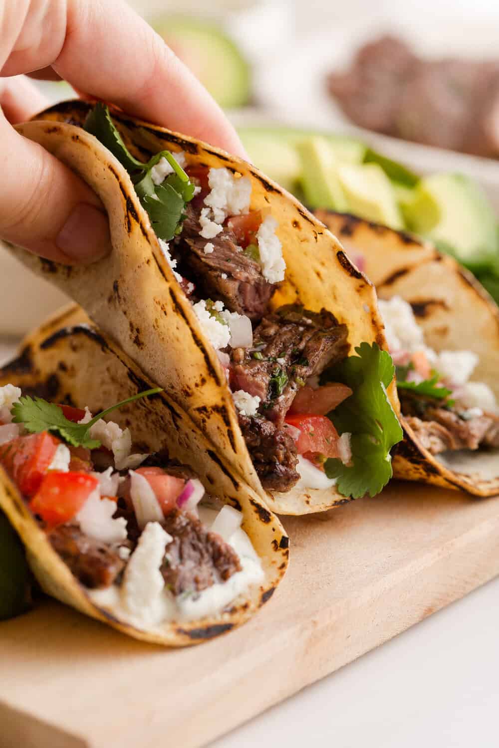 hand holding a carne asada taco