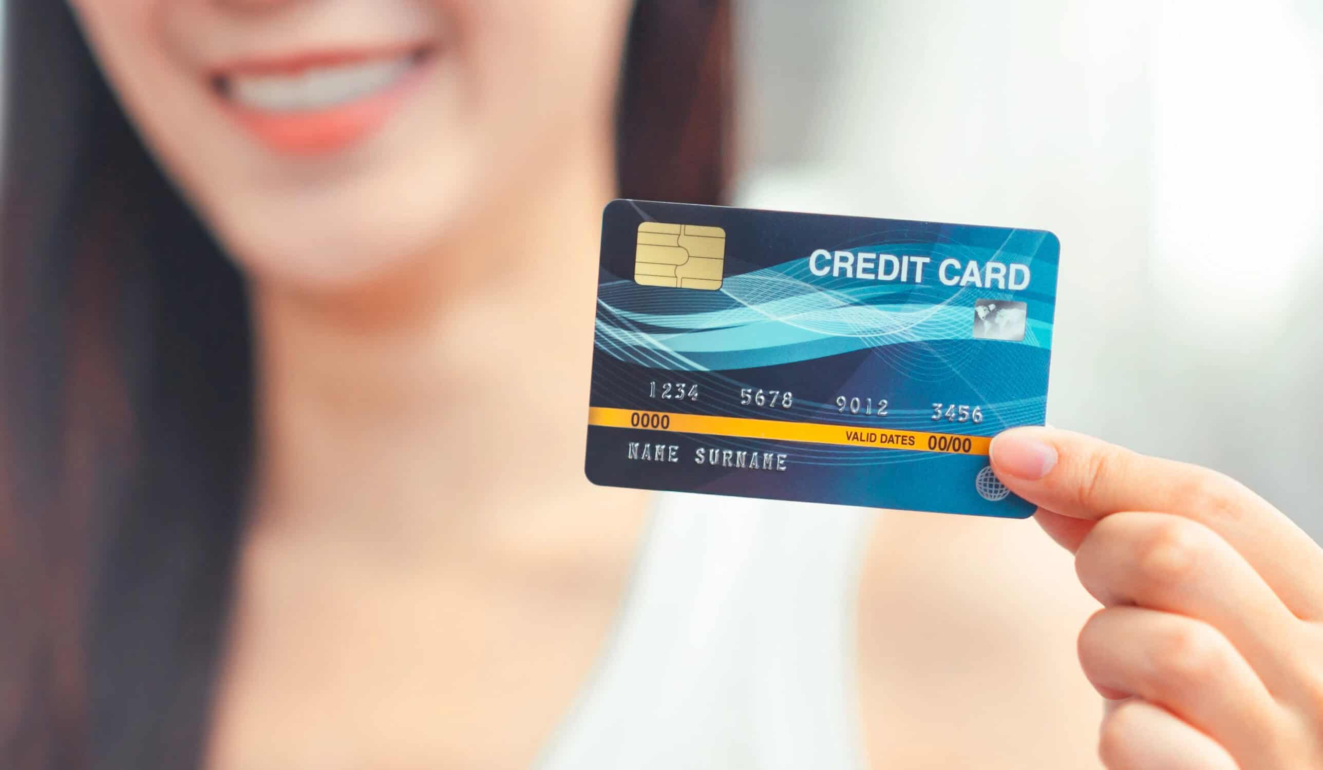 girl holding a credit card