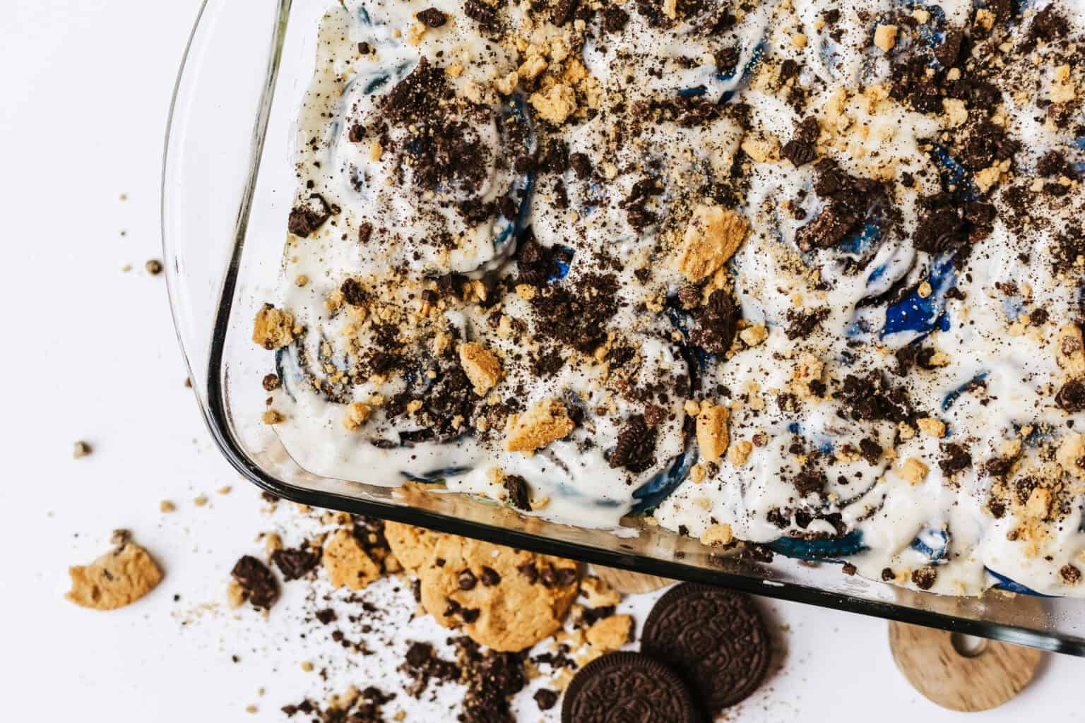 cookie monster cinnamon rolls with crushed cookies over icing