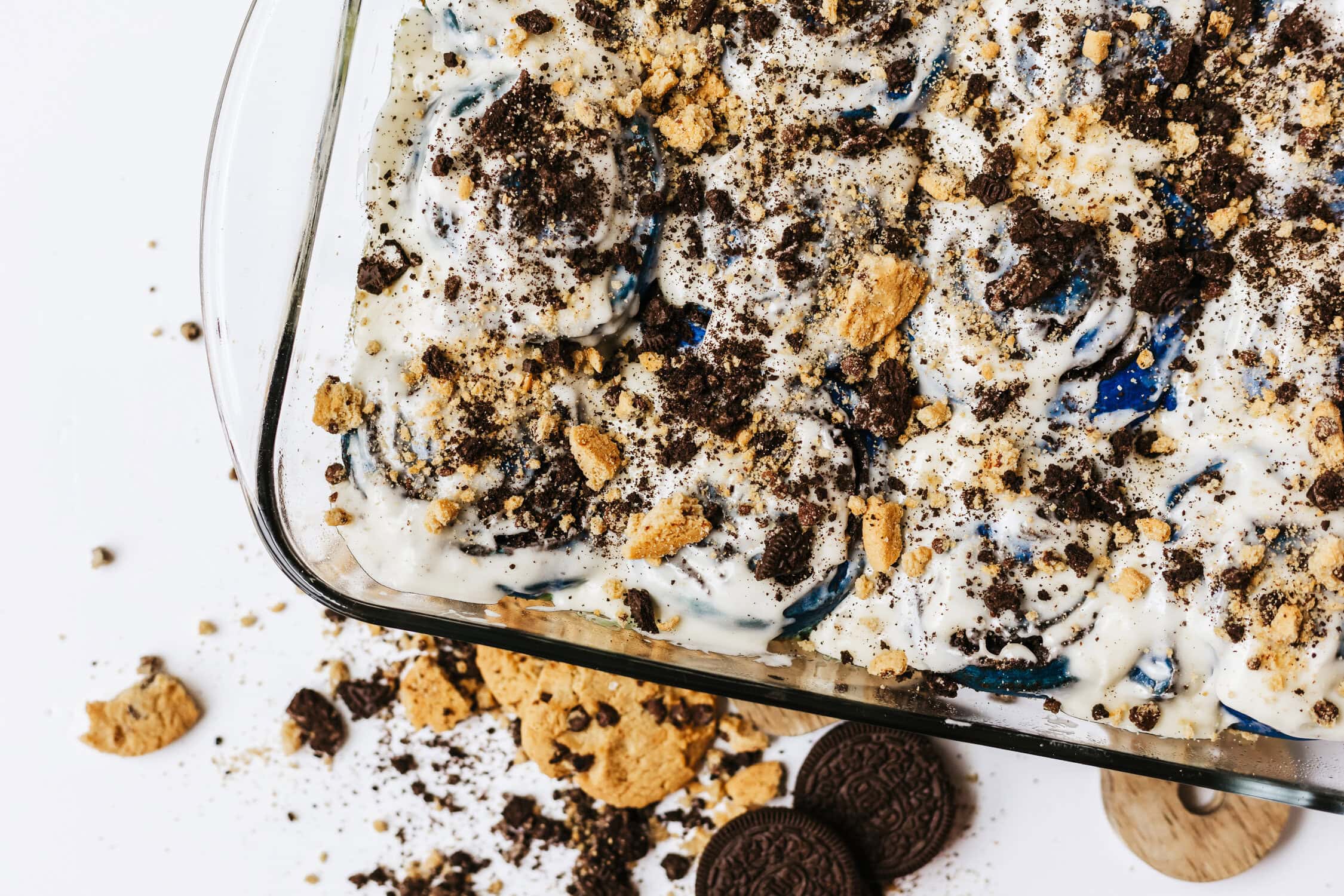 cookie monster cinnamon rolls with crushed cookies over icing