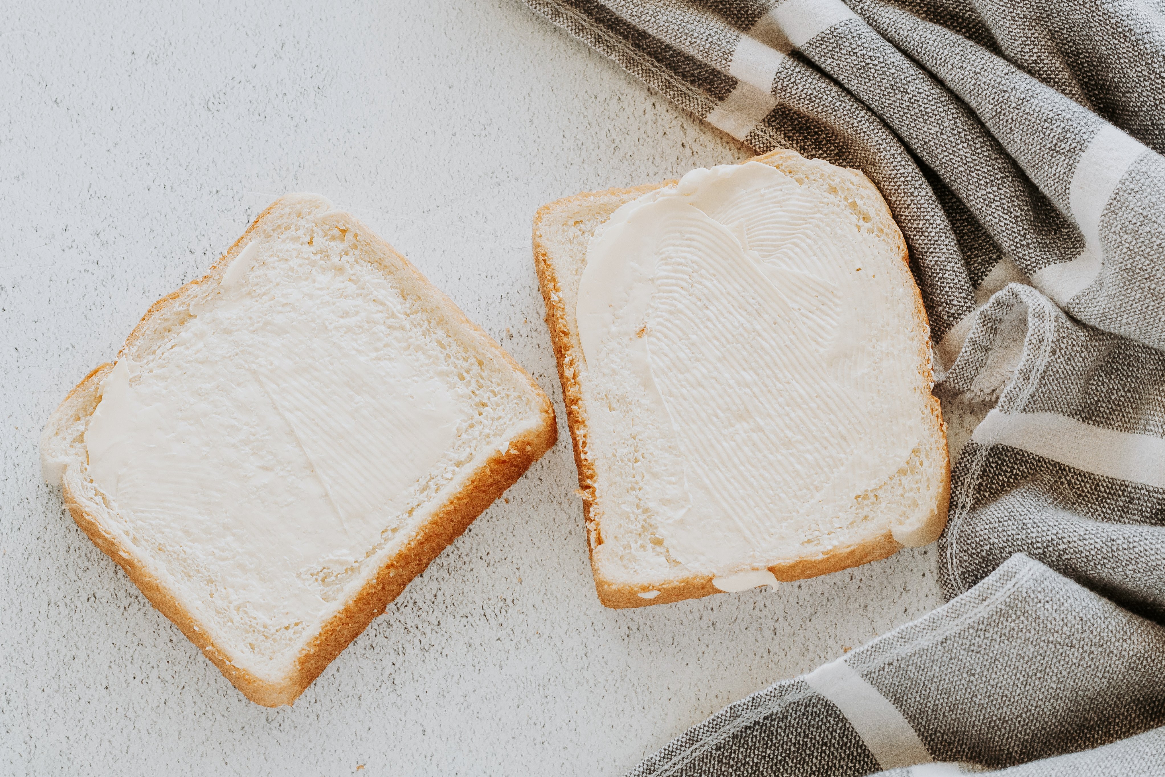 butter on slice of bread