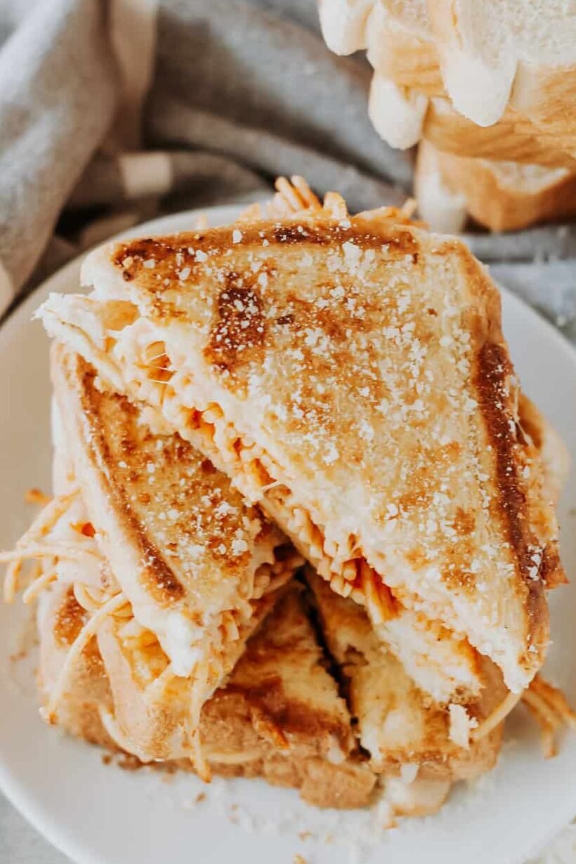 spaghetti grilled cheese cut into triangles