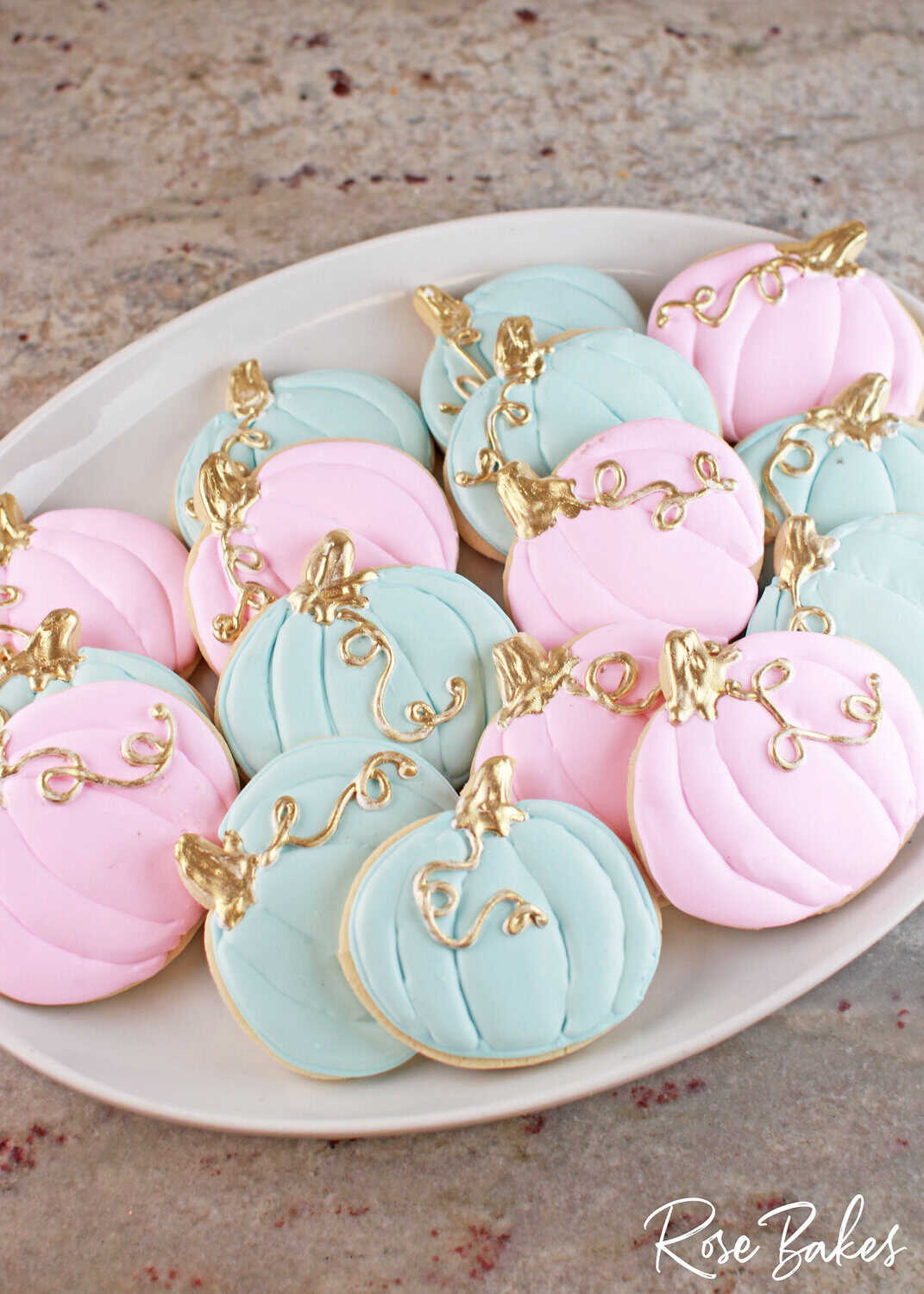 pink and blue gender reveal pumpkin cookies for "what will our little pumpkin be?" baby gender reveal party