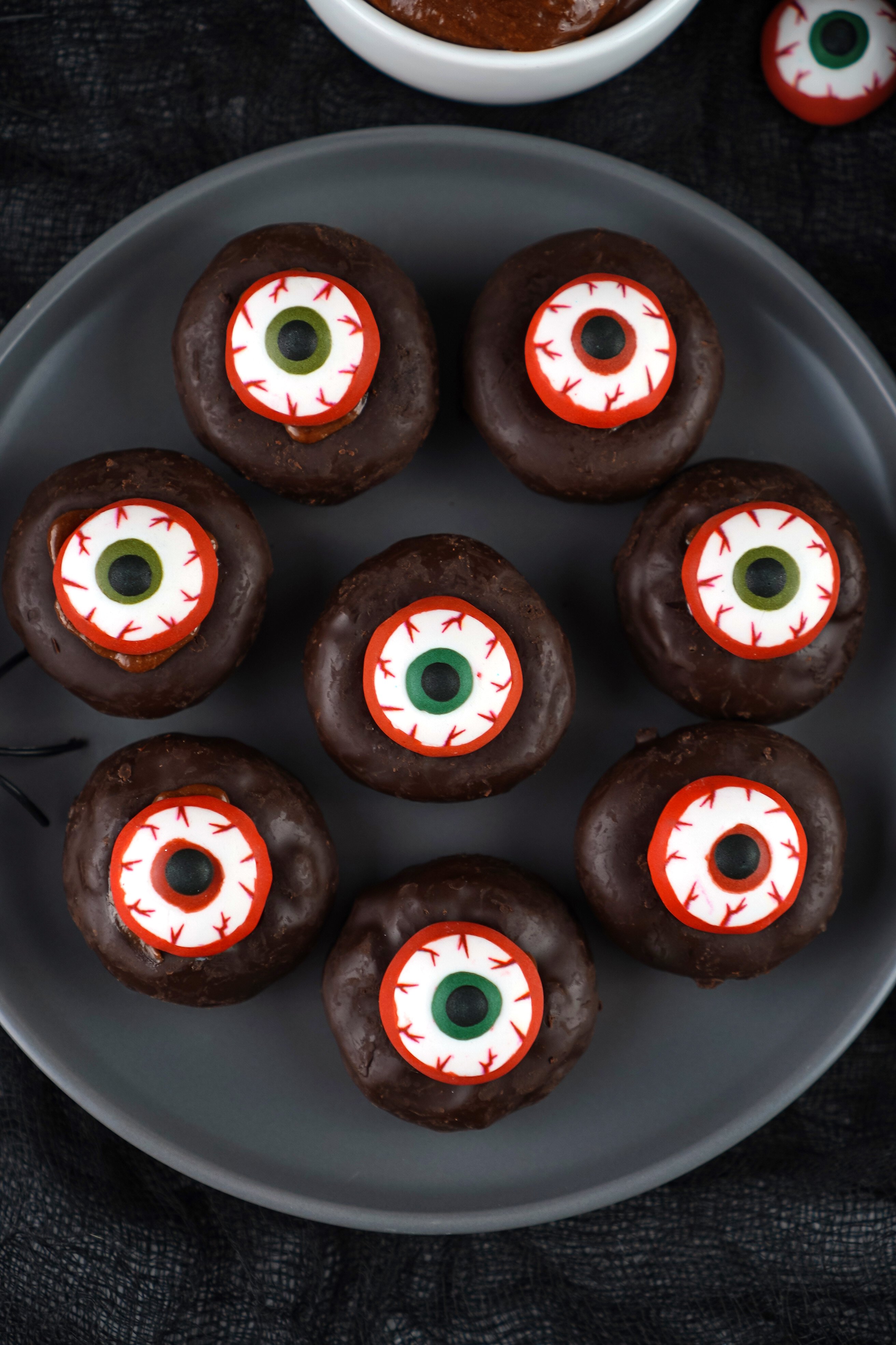 mini eyeball donuts on a plate