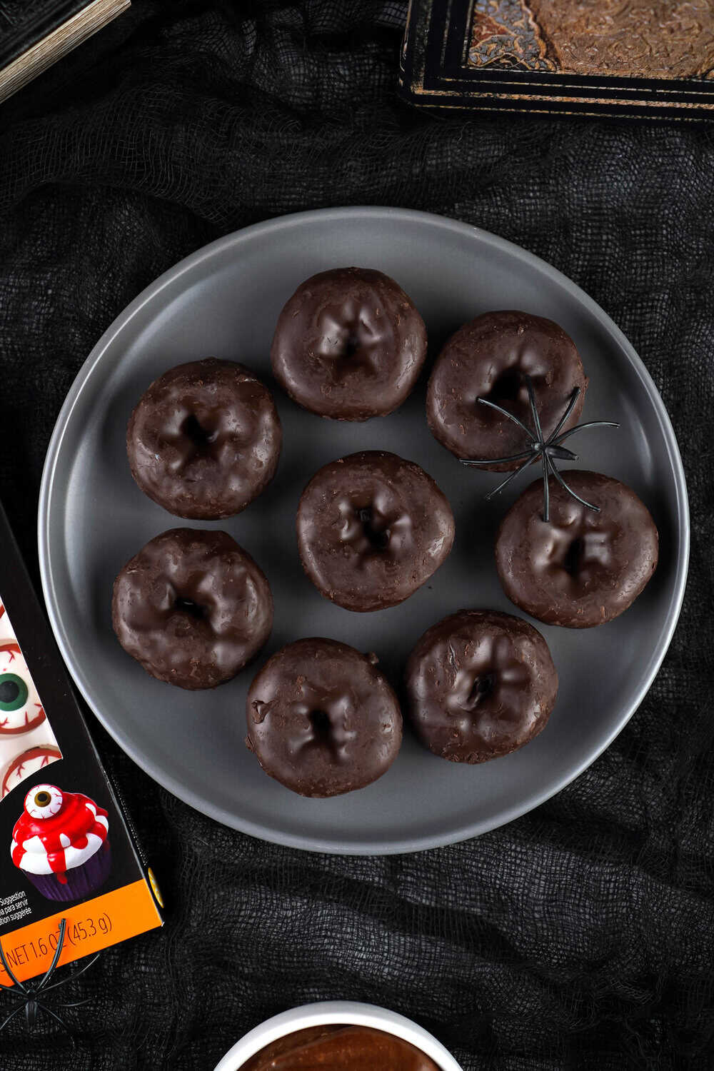 plain mini chocolate donuts on a plate