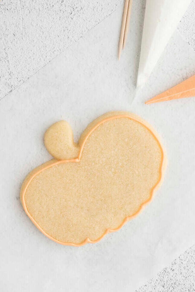 pumpkin cookie with frosting outline