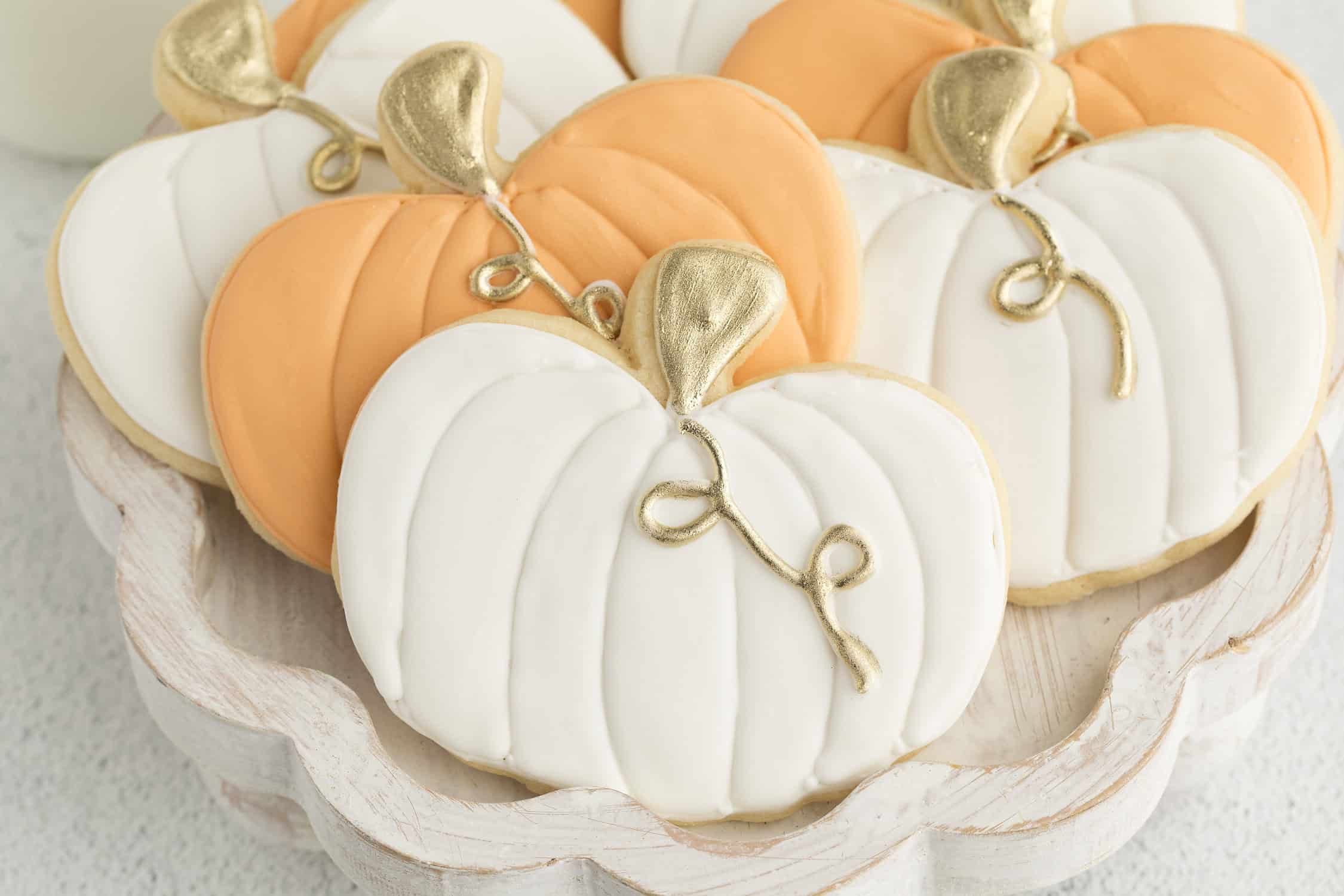 orange and white decorated pumpkin cookies