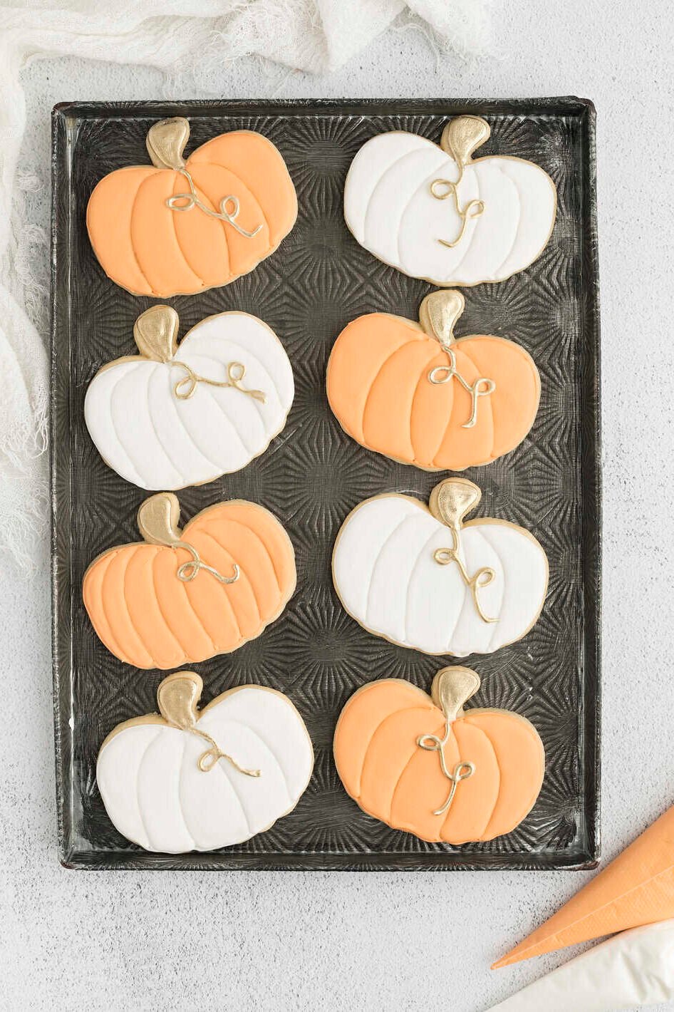 cookies lined up in a single layer on a cookie sheet