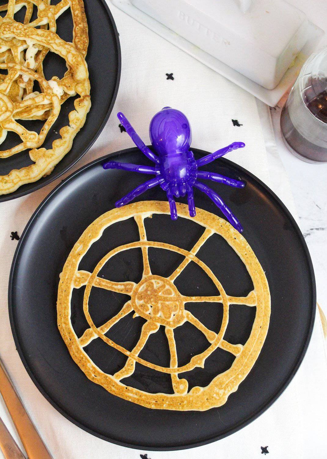 spiderweb pancakes with fake spider