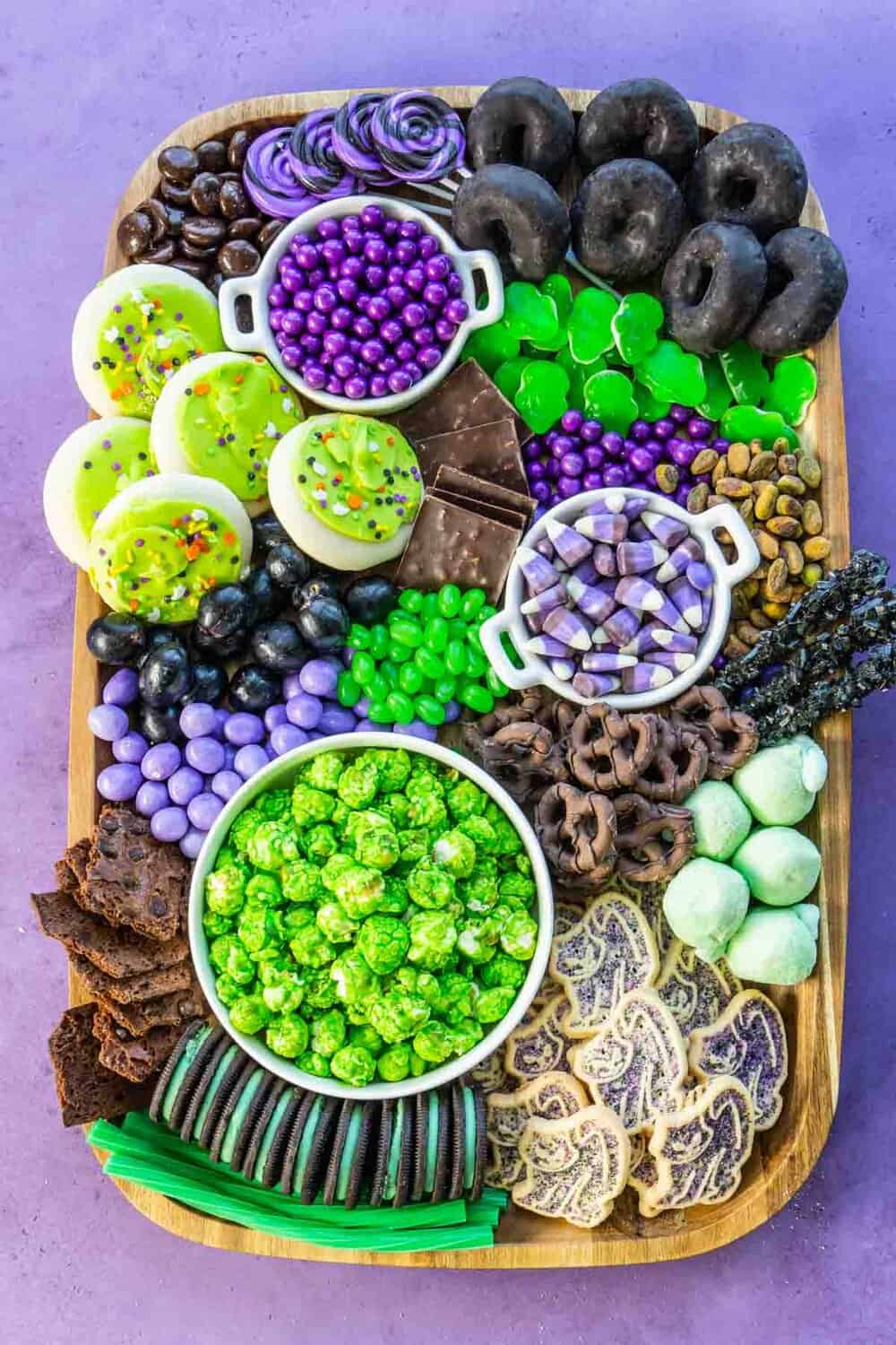 purple green and black halloween dessert board
