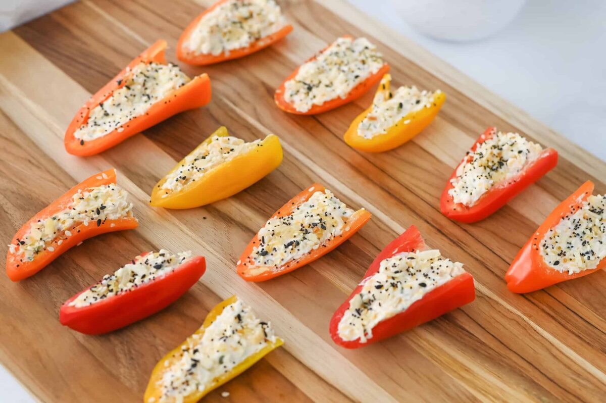stuffed mini peppers on a cutting board