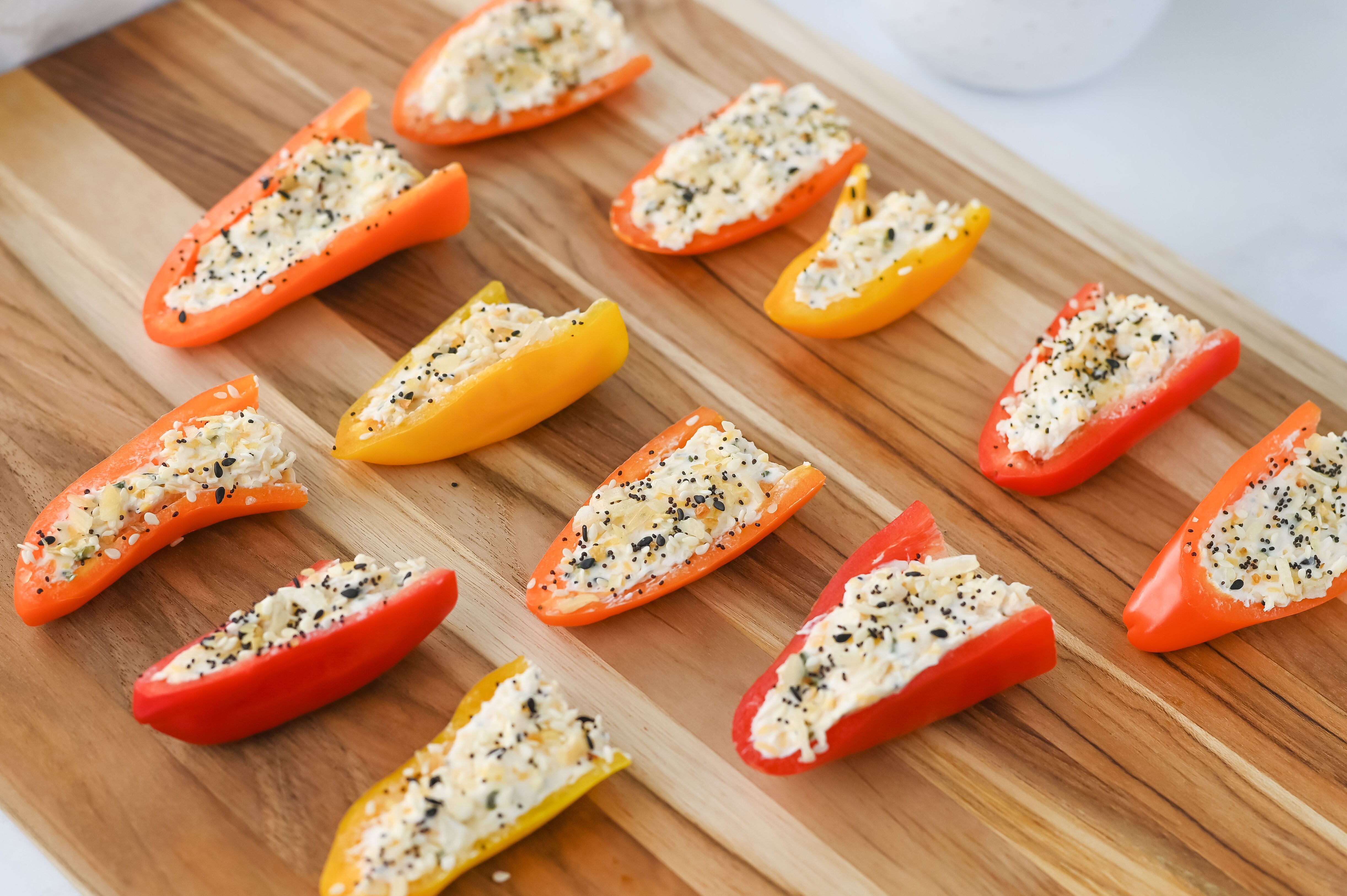 stuffed mini peppers on a cutting board
