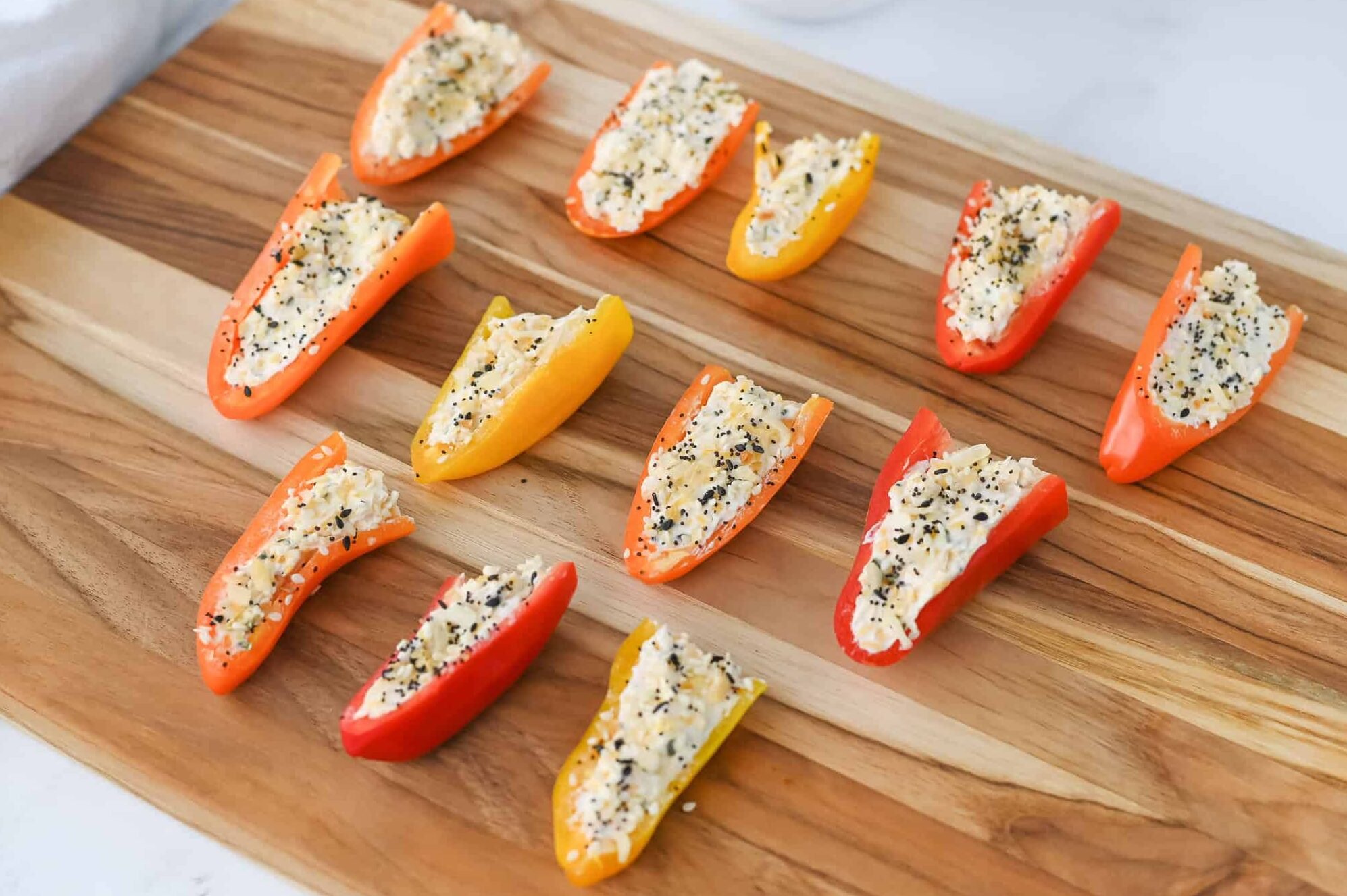 mini stuffed peppers on a cutting board