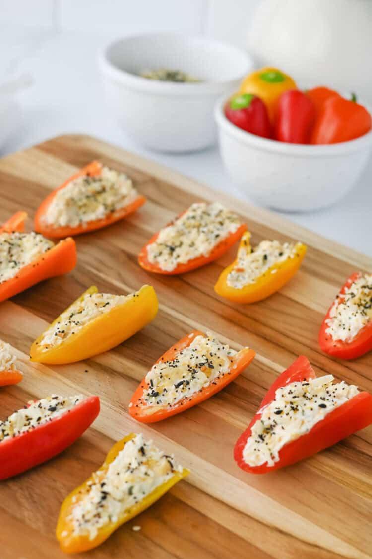 stuffed mini peppers on a cutting board