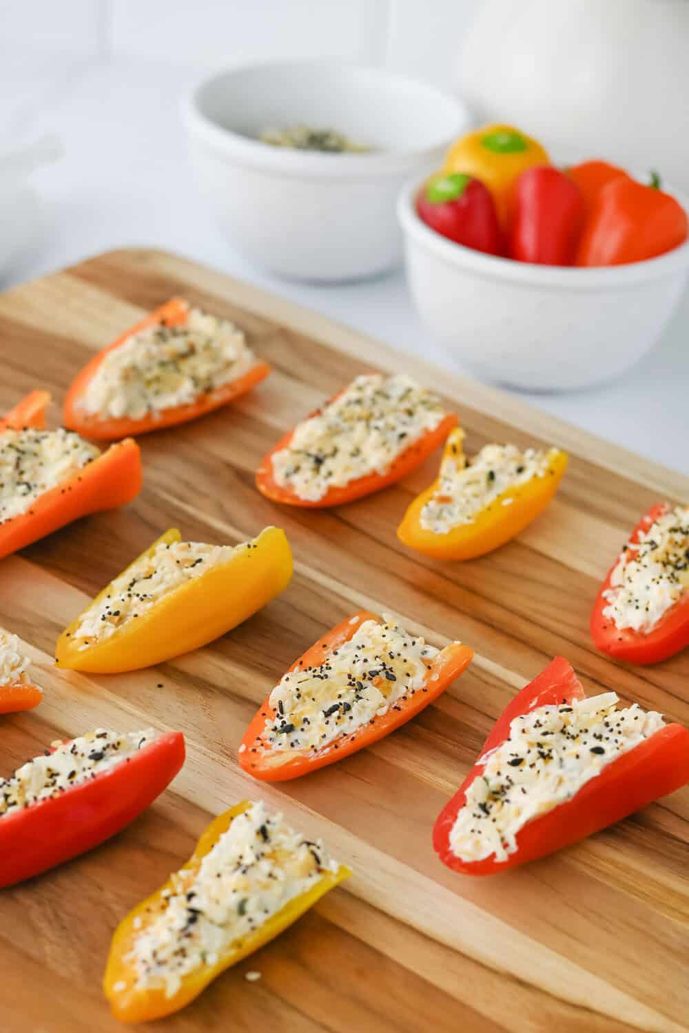 stuffed mini peppers on a cutting board