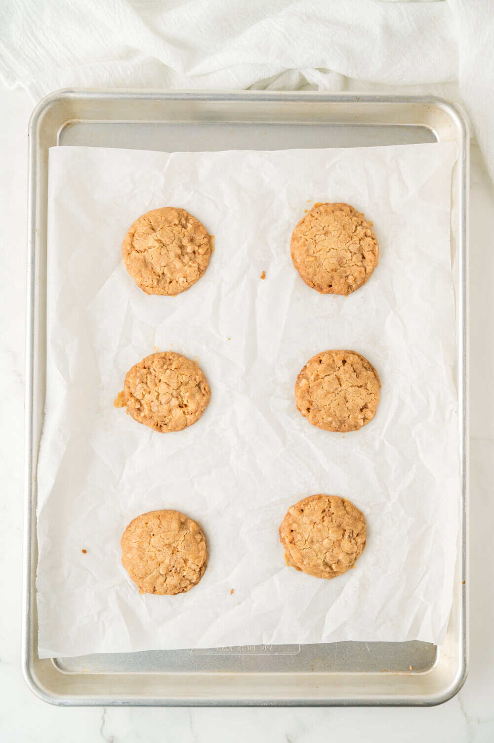 baked butter crisp cookies on a cookie sheet