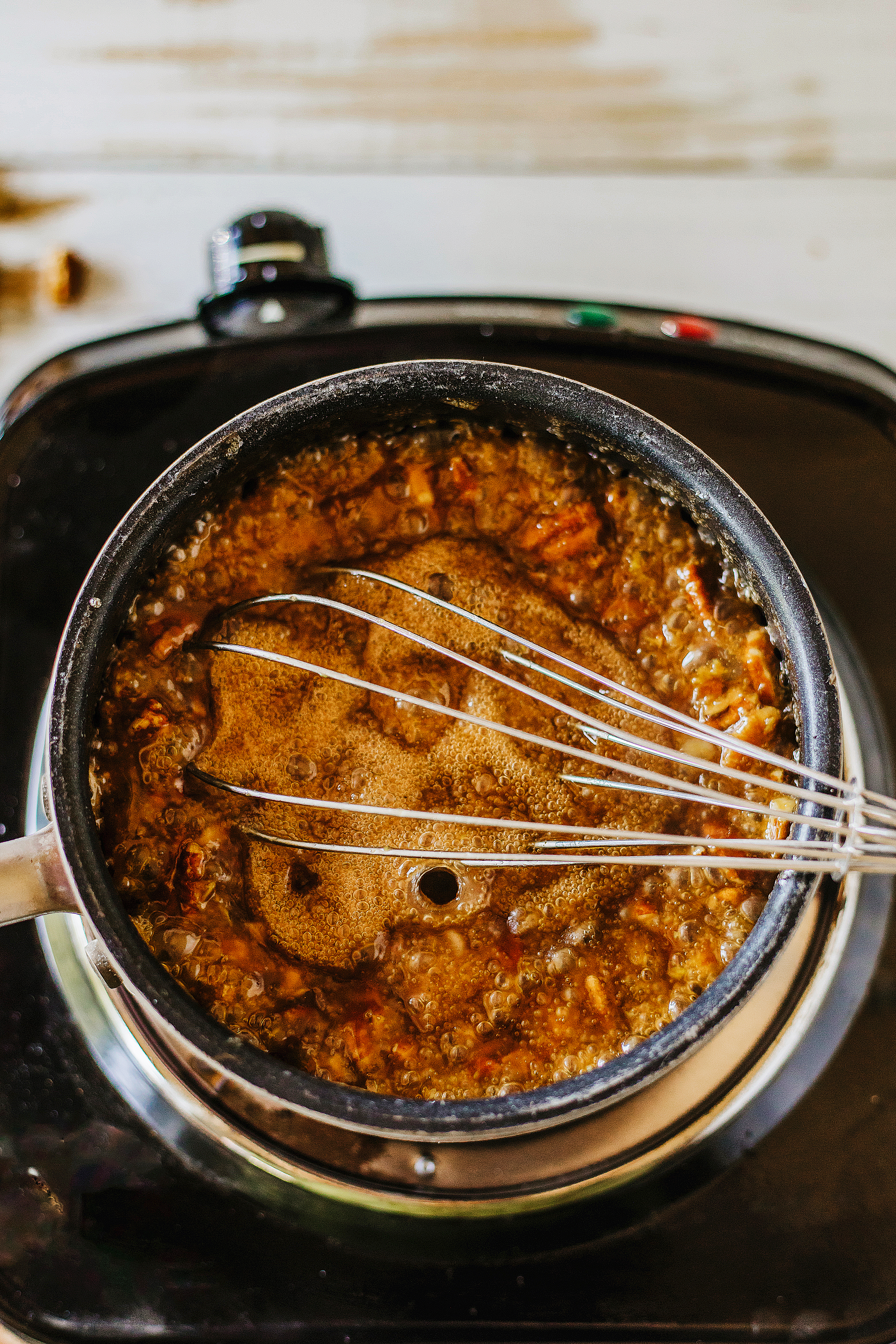 cooked pecan pie filling in saucepan