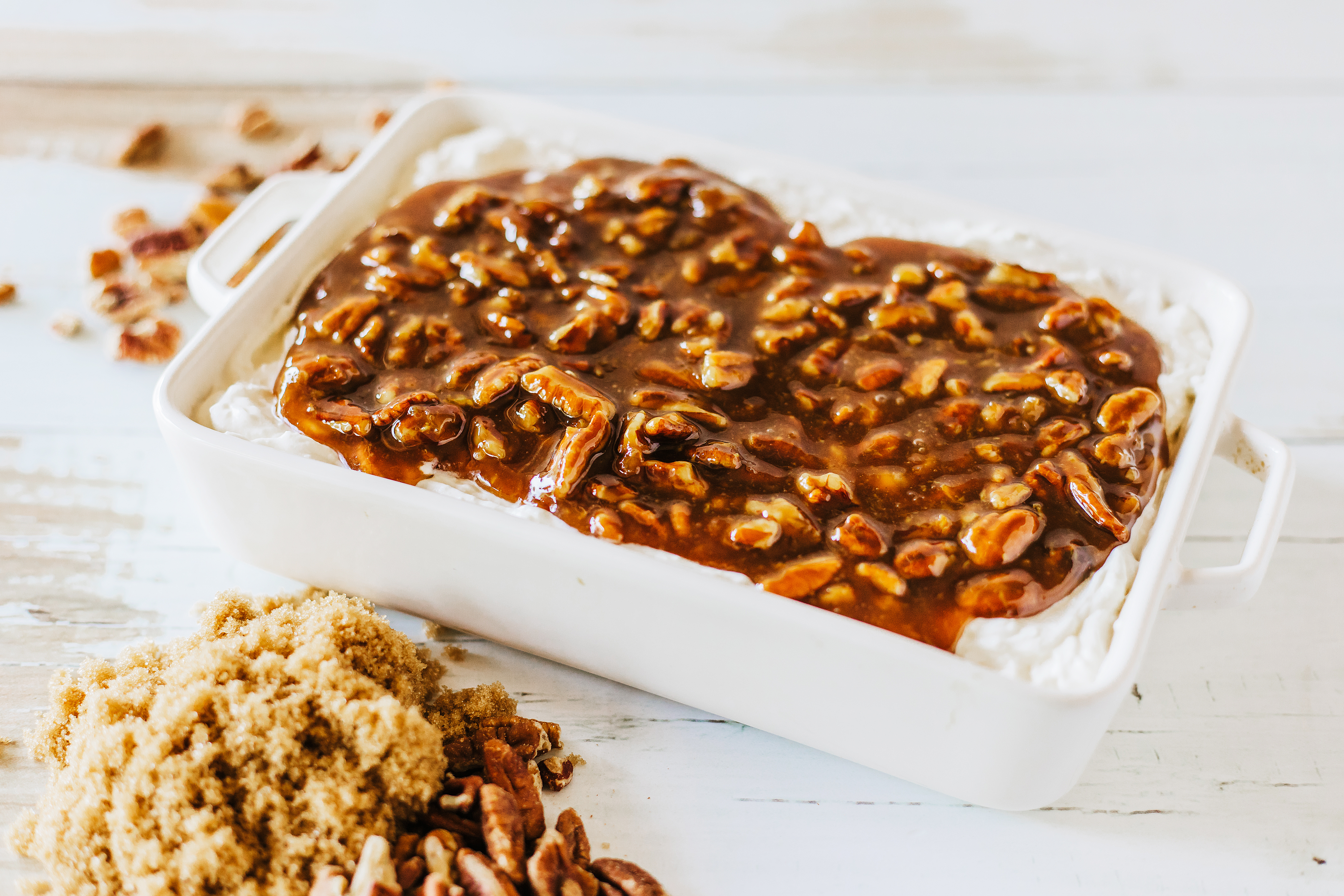 pecan pie filling poured over cream cheese base