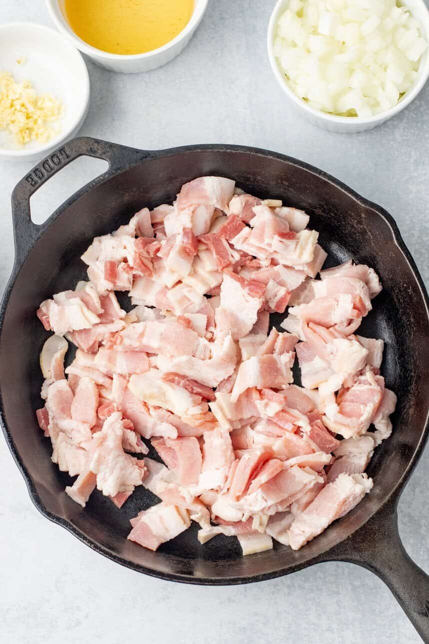 raw bacon in a skillet