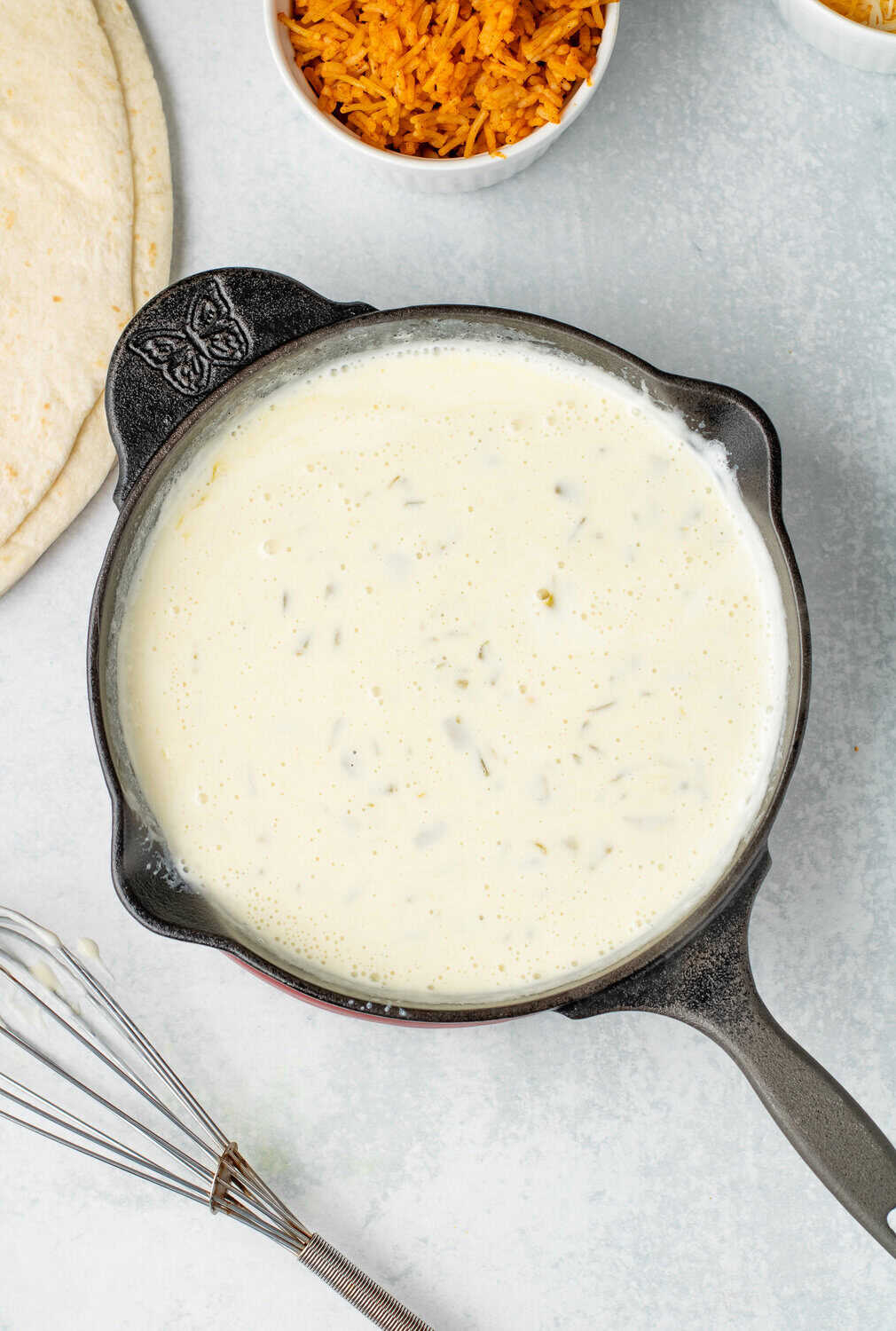 finished queso dip in a cast iron skillet