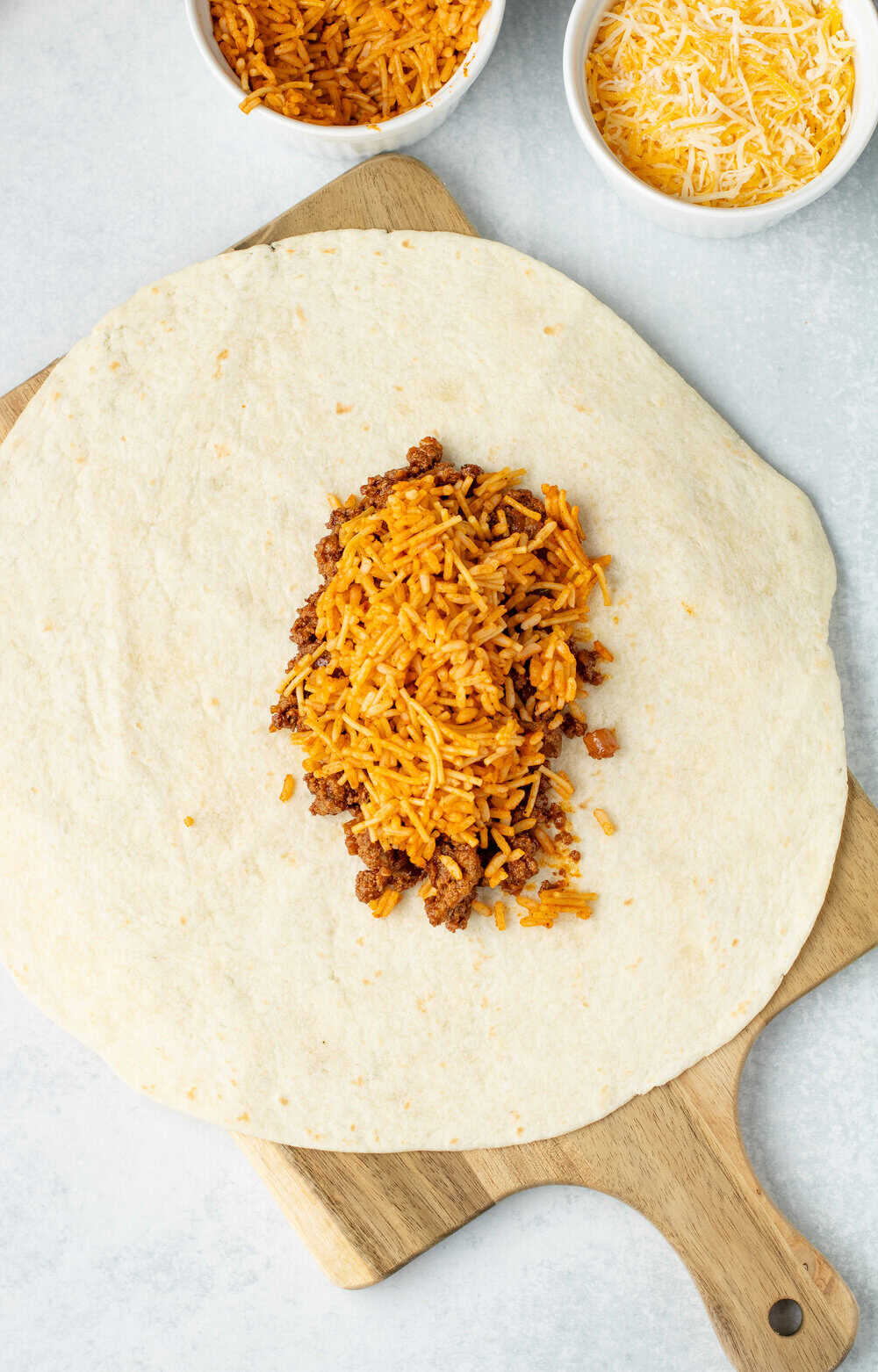 taco meat and rice on a large burrito