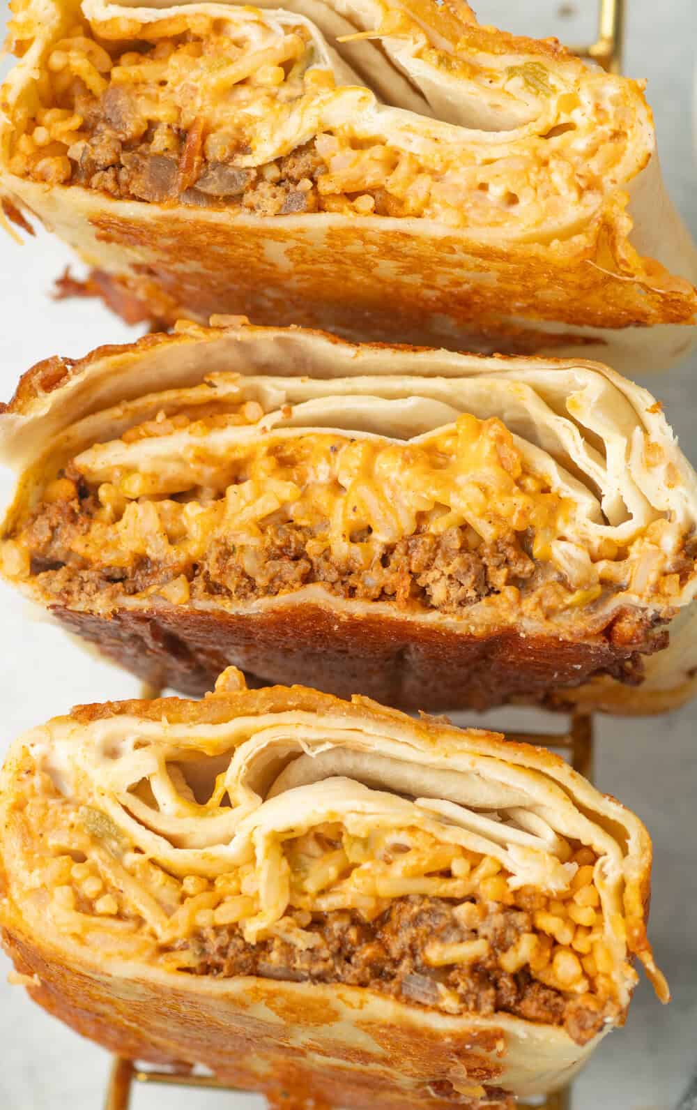 grilled cheese burritos cut in half and standing on end