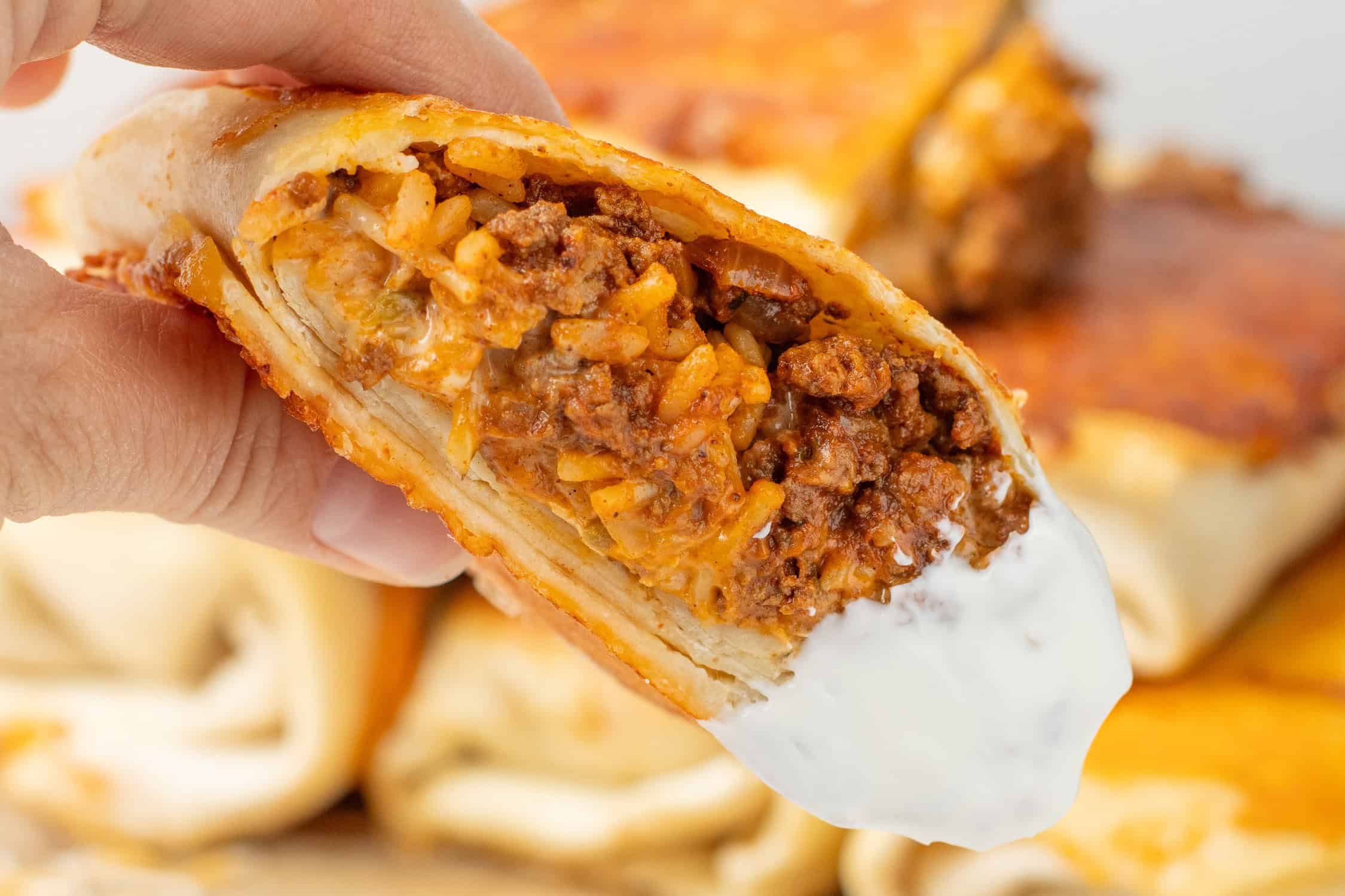 grilled cheese burrito dipped in sour cream