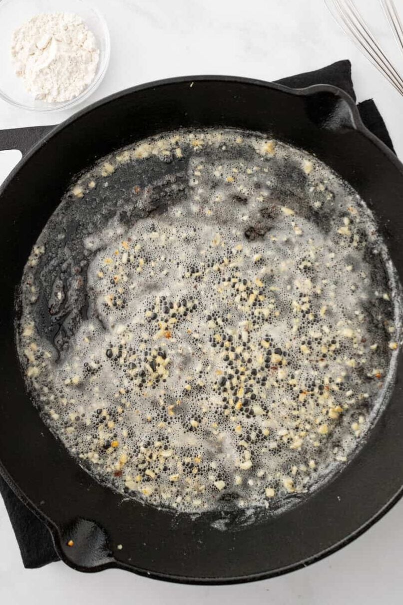 garlic in melted butter in skillet