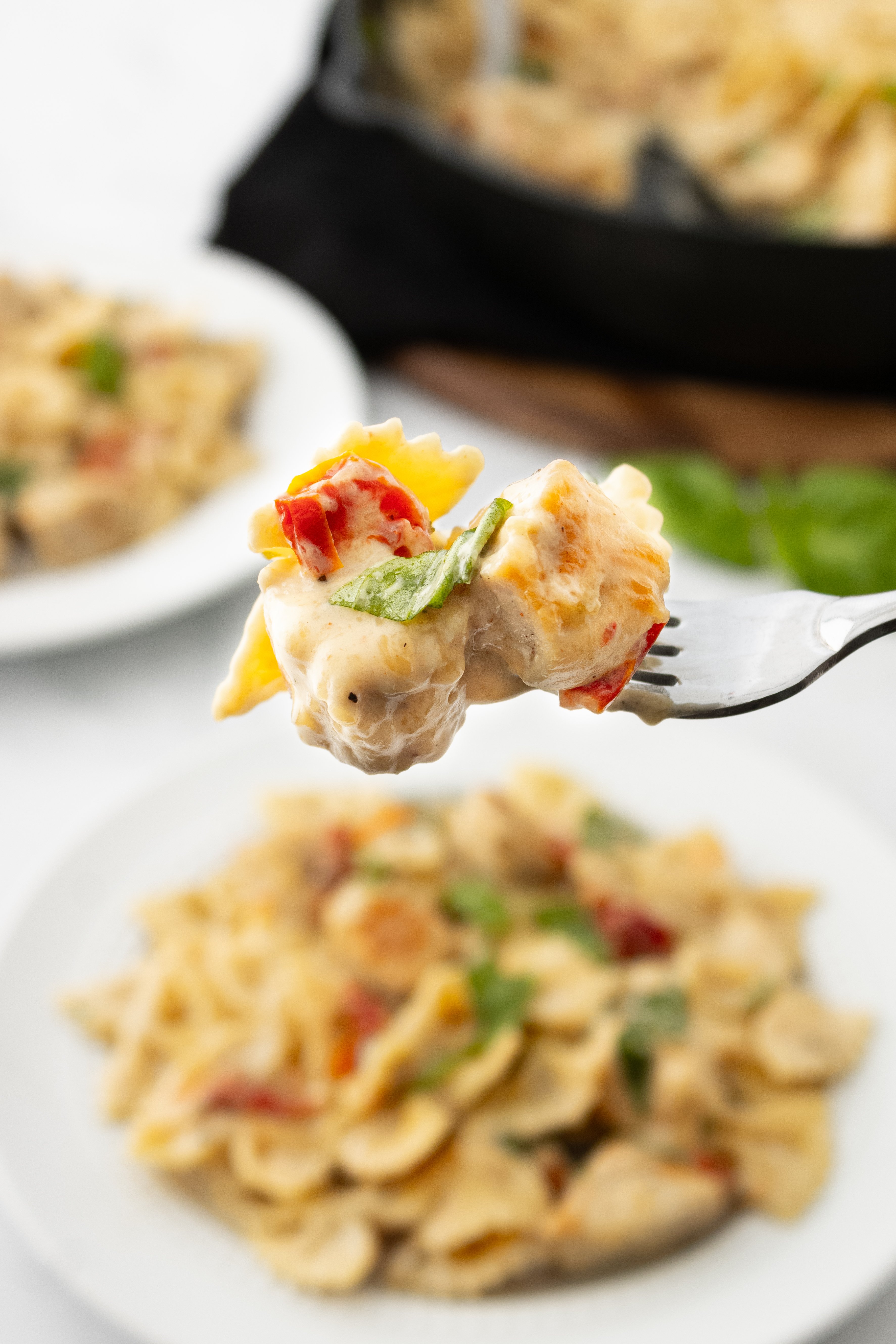 a bite of marry me chicken pasta on a fork