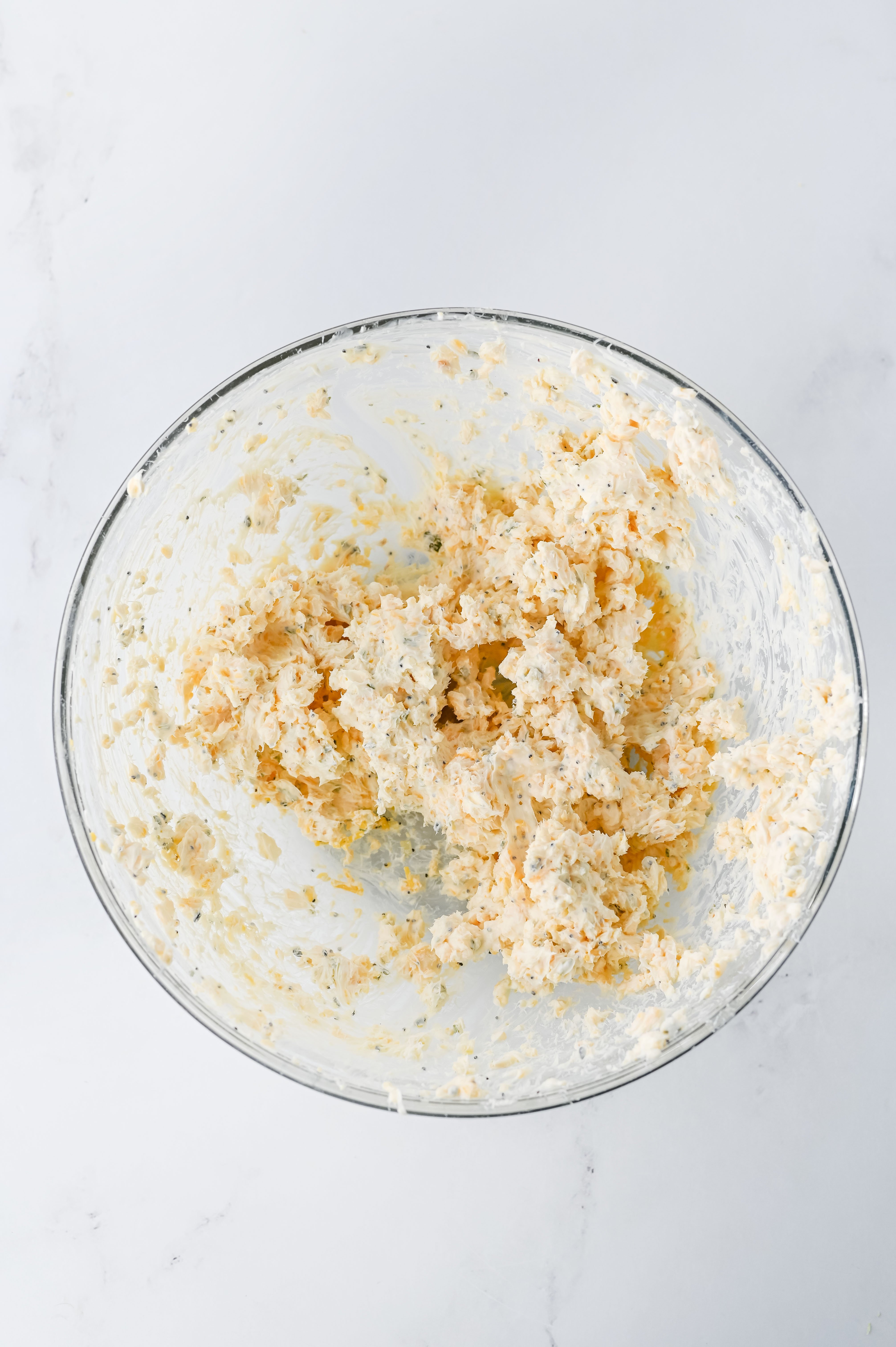 creamy cheese filling mixed up in a mixing bowl