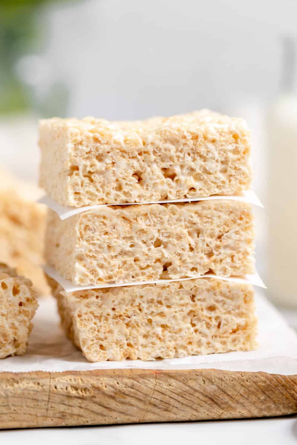 brown butter rice krispie treats stacked on a cutting board