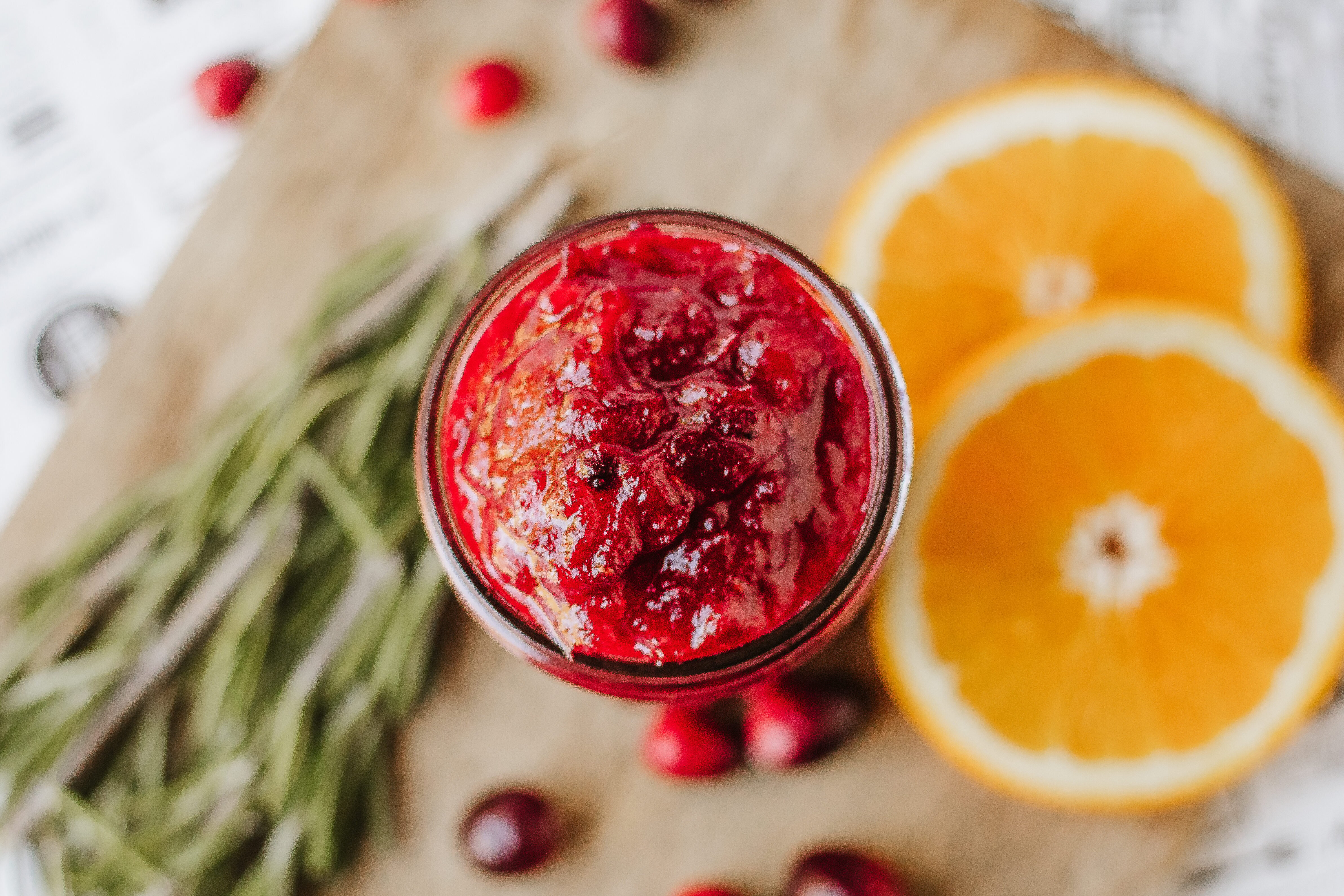 cranberry jam on a cutting board in a mason jar