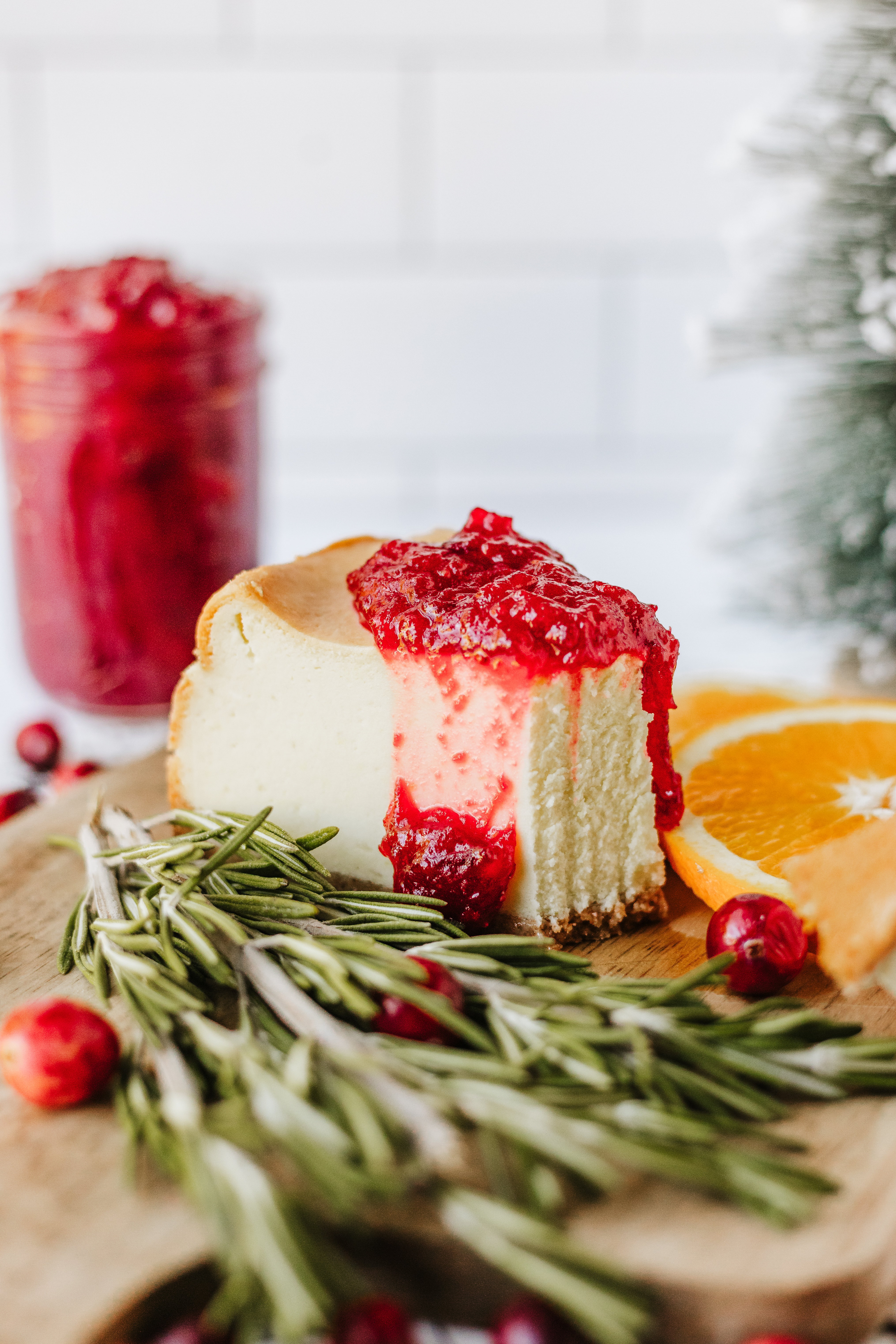 cranberry jam over a slice of cheesecake