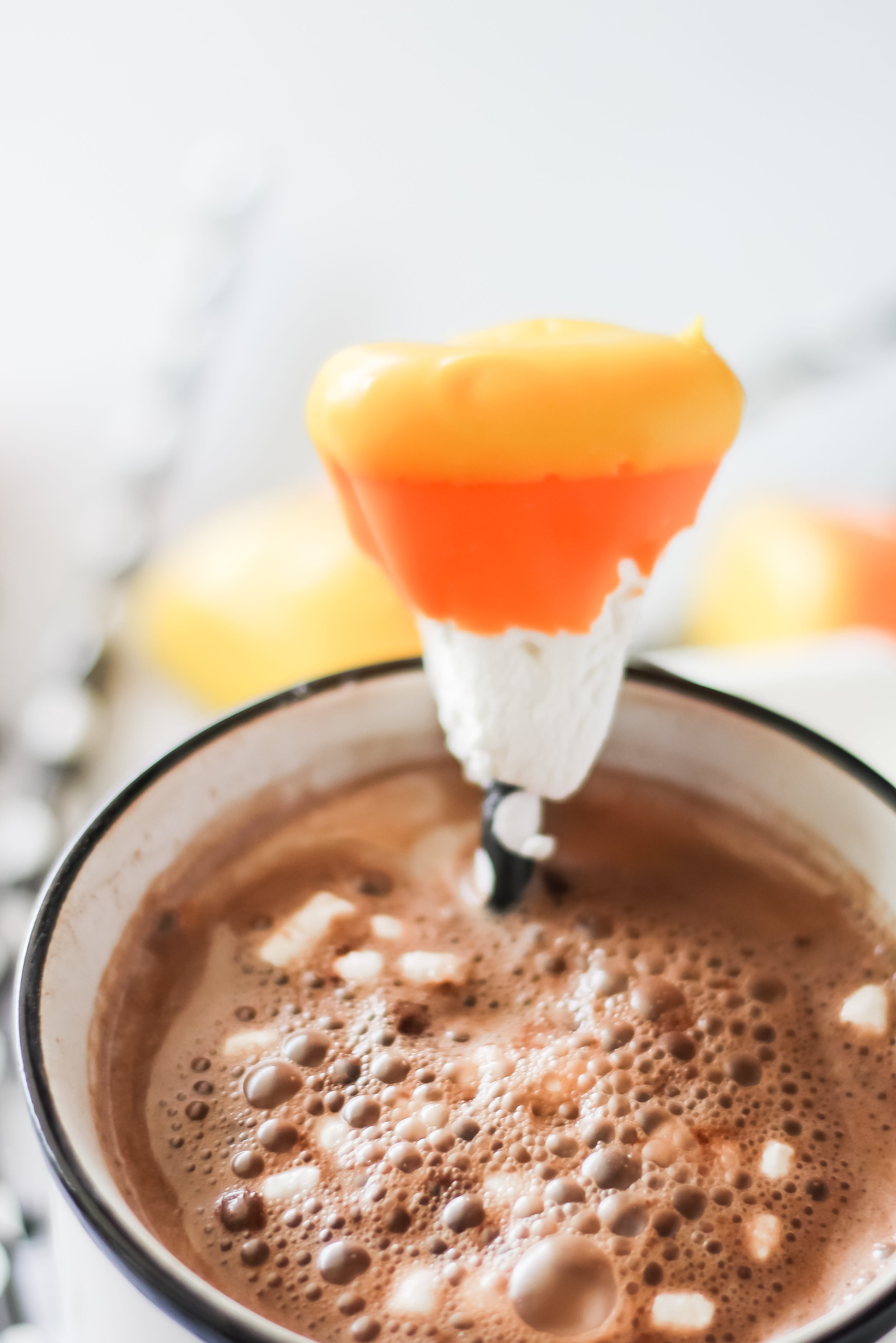 candy corn marshmallow in a mug of hot chocolate