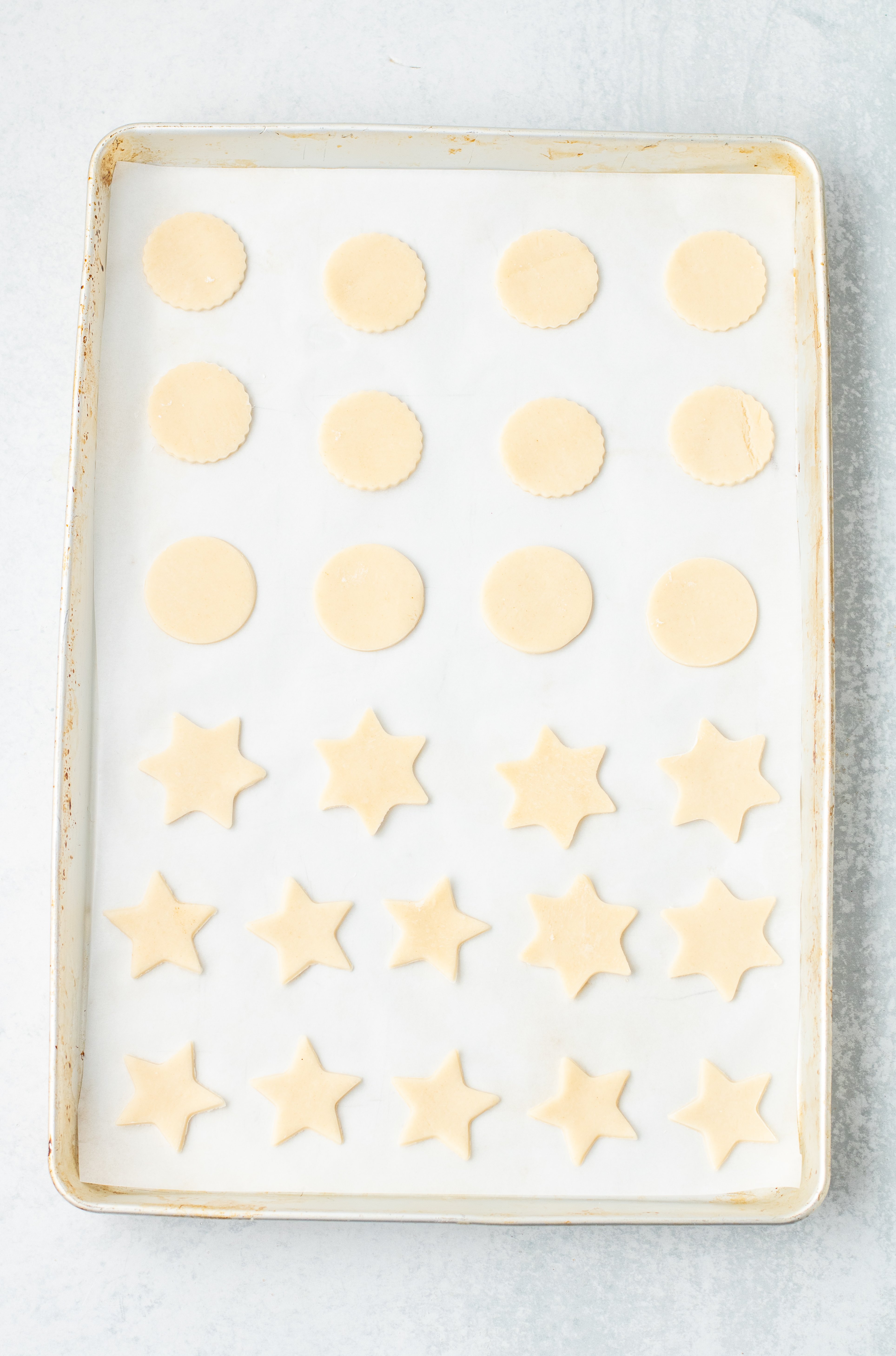 pie crust cookies on a parchment paper lined baking sheet