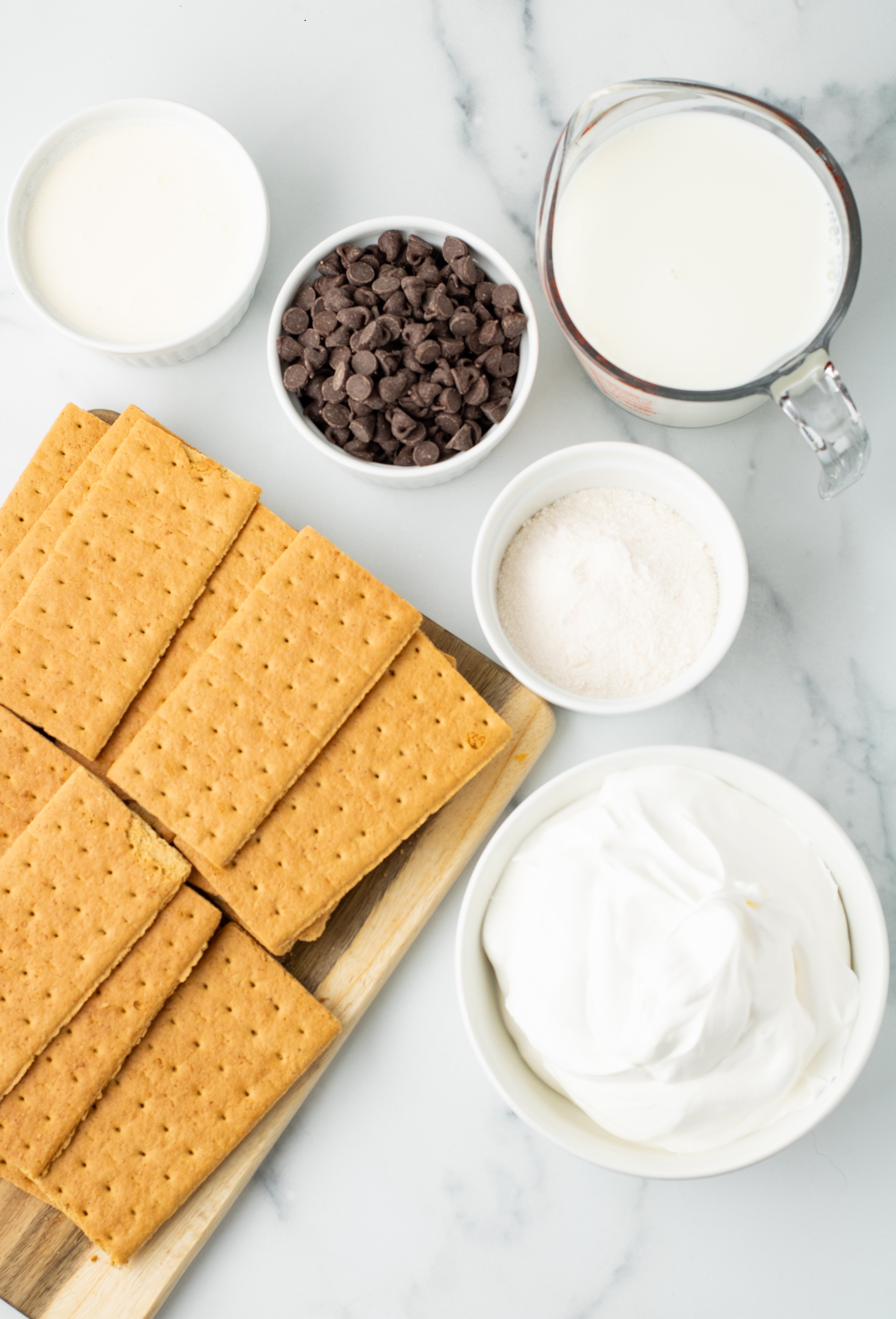 chocolate eclair cake ingredients on a white surface
