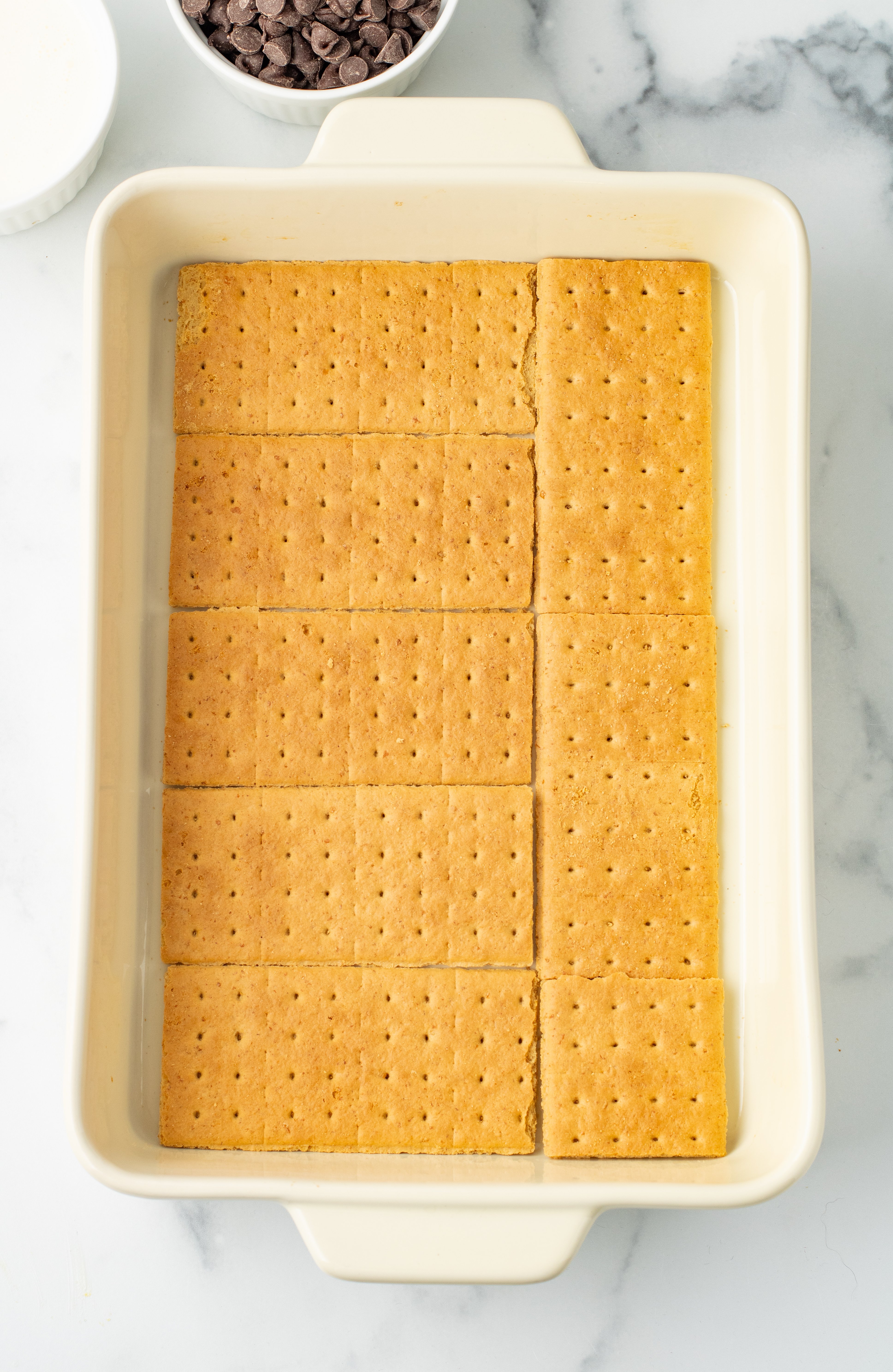 graham crackers in the bottom of a 9x13 baking dish