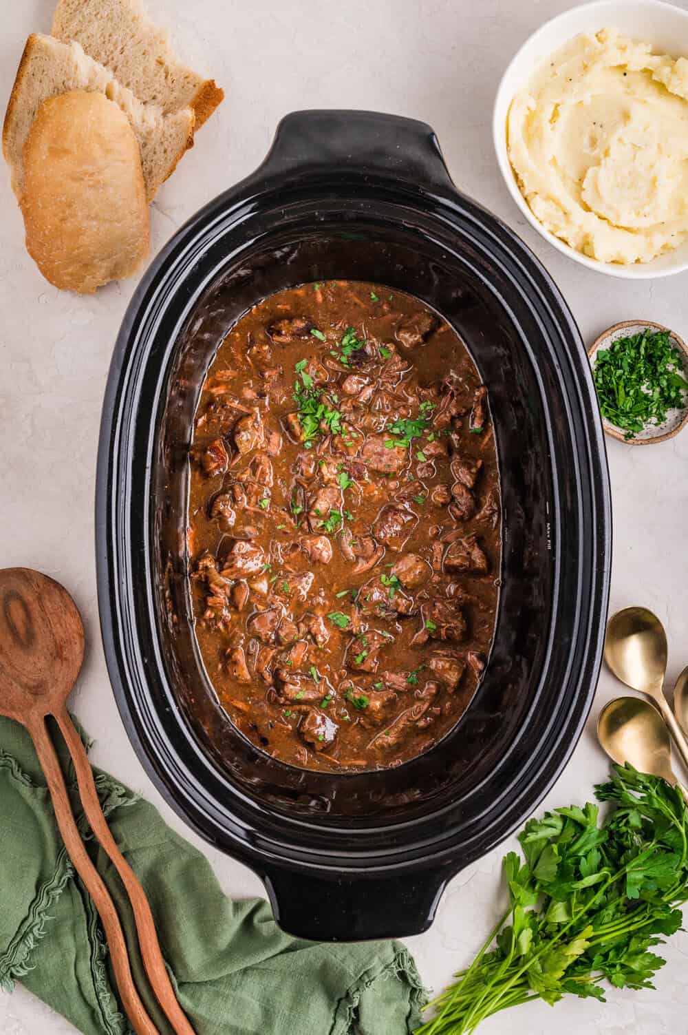 cooked garlic butter steak bites in slow cooker