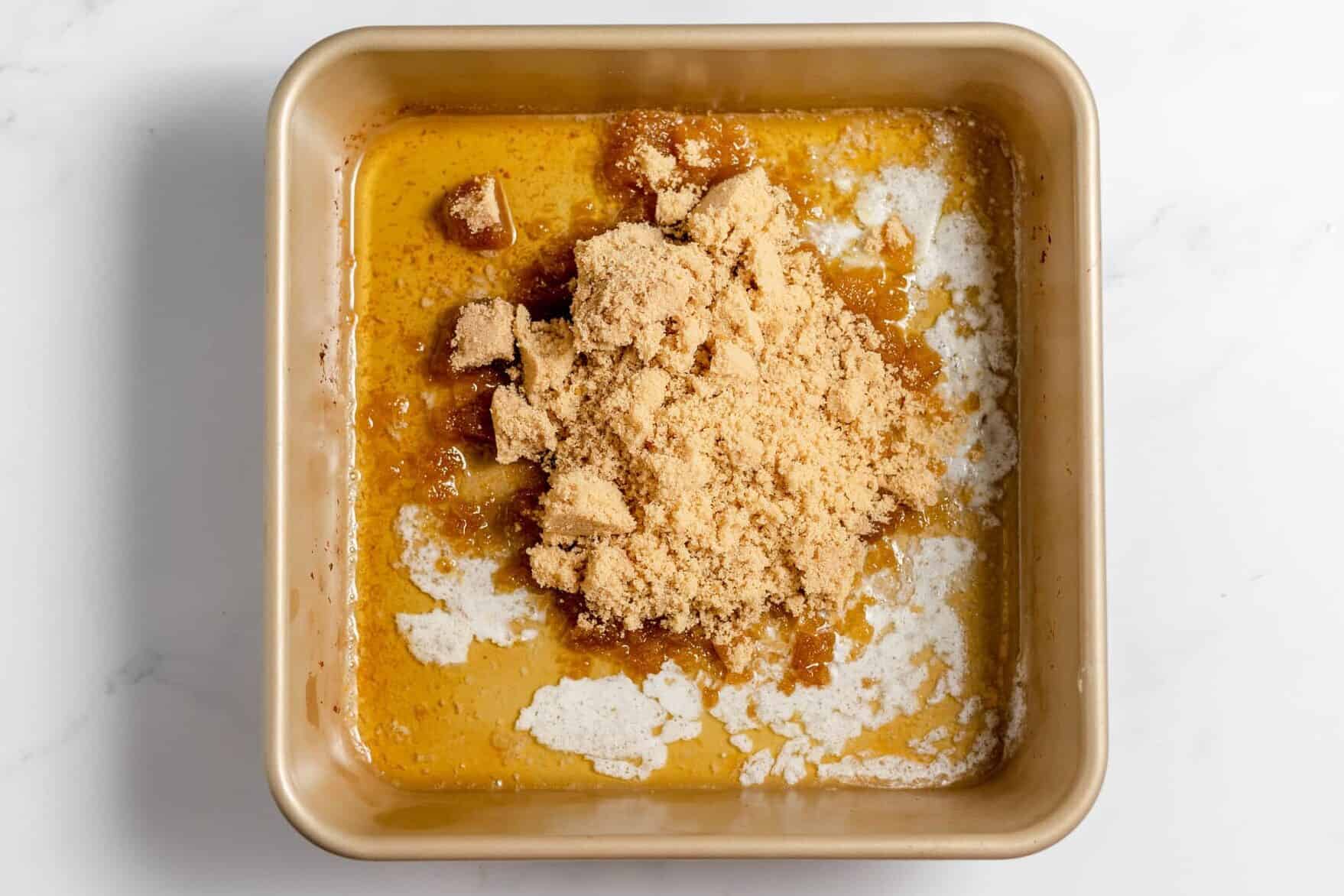brown sugar added to melted butter in 8x8 pan