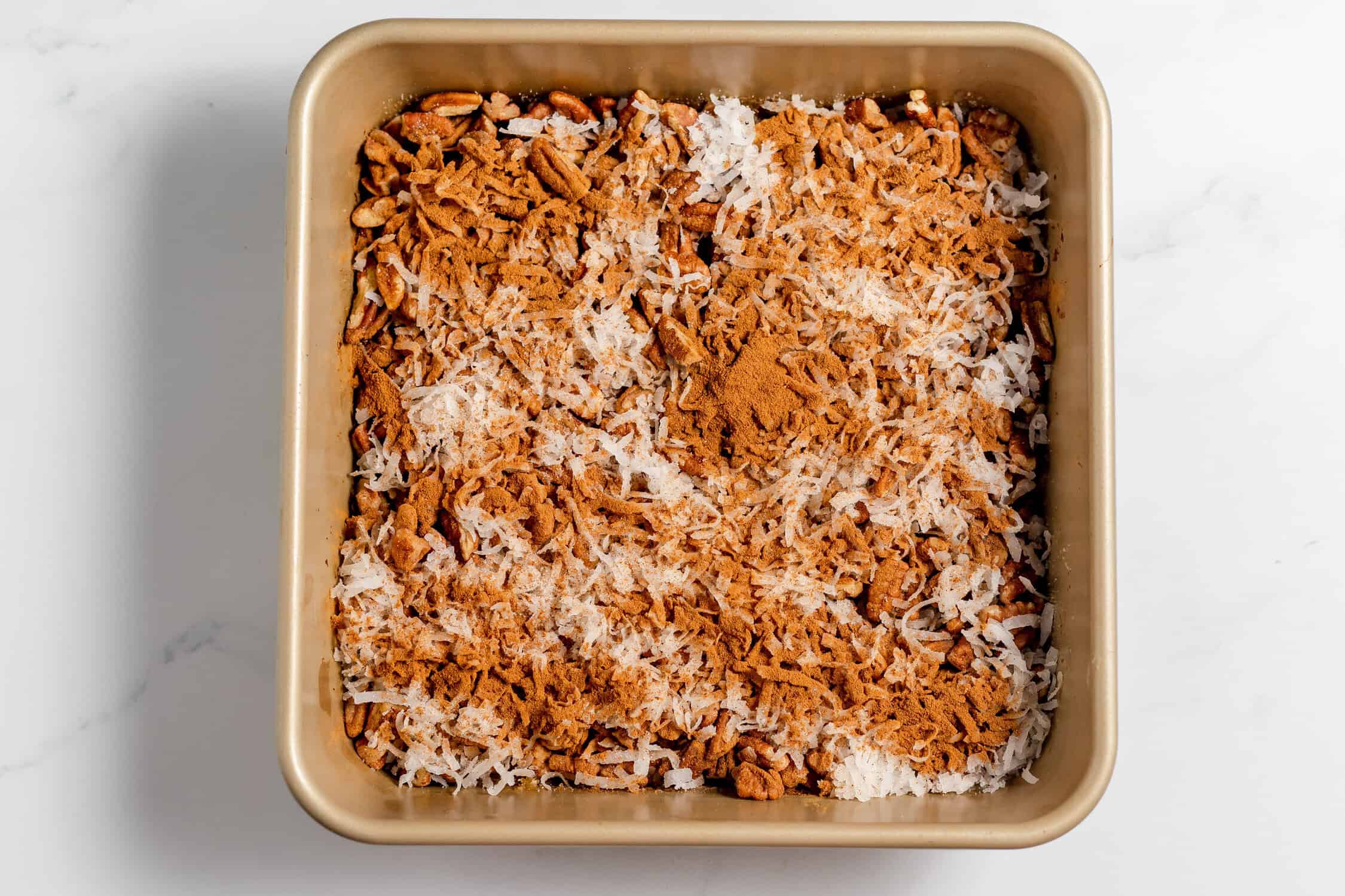 cinnamon over the top of the coconut and pecans
