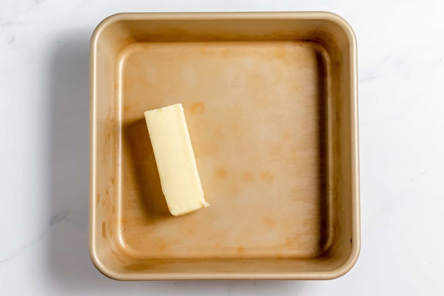 stick of butter in 8x8 pan