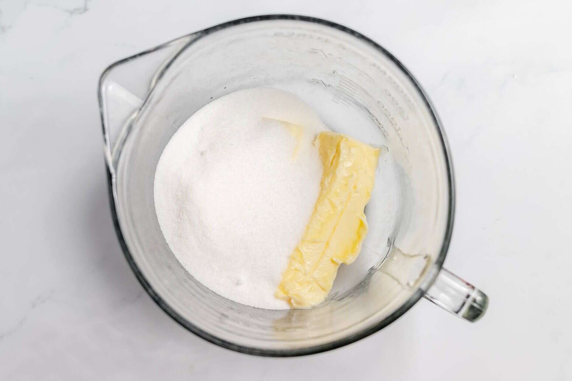 butter and sugar in a mixing bowl