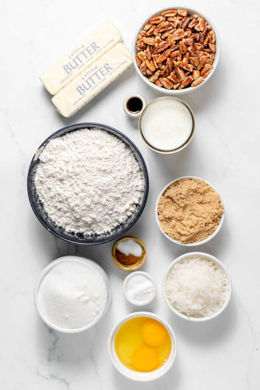 pecan upside down cake ingredients on a white surface - each ingredient in an individual bowl