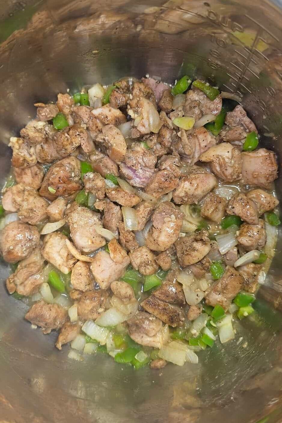cooked chicken, onions, peppers and garlic in instant pot